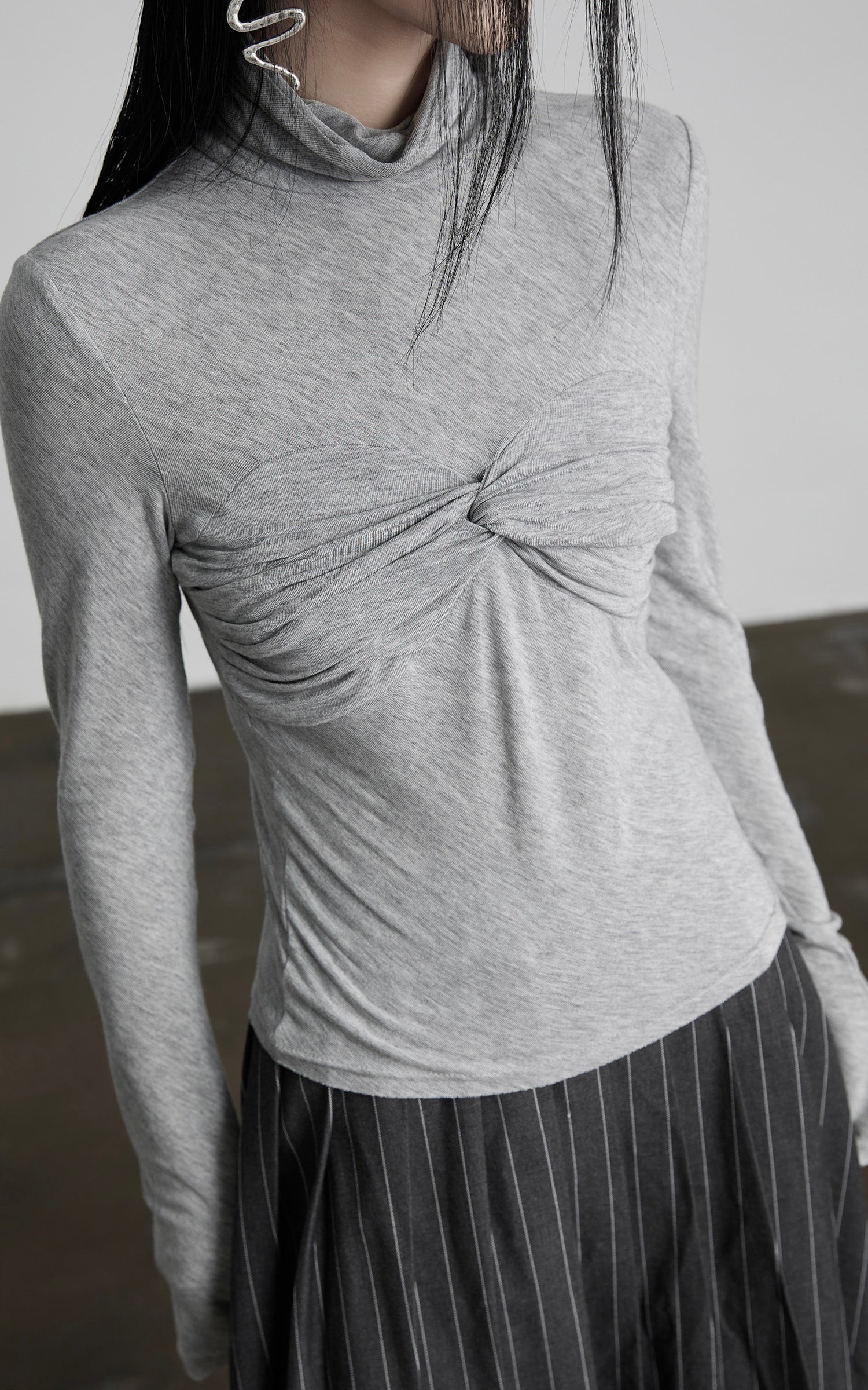 INDULGE Draped Twist Knit Top with High Neck and Long Sleeves