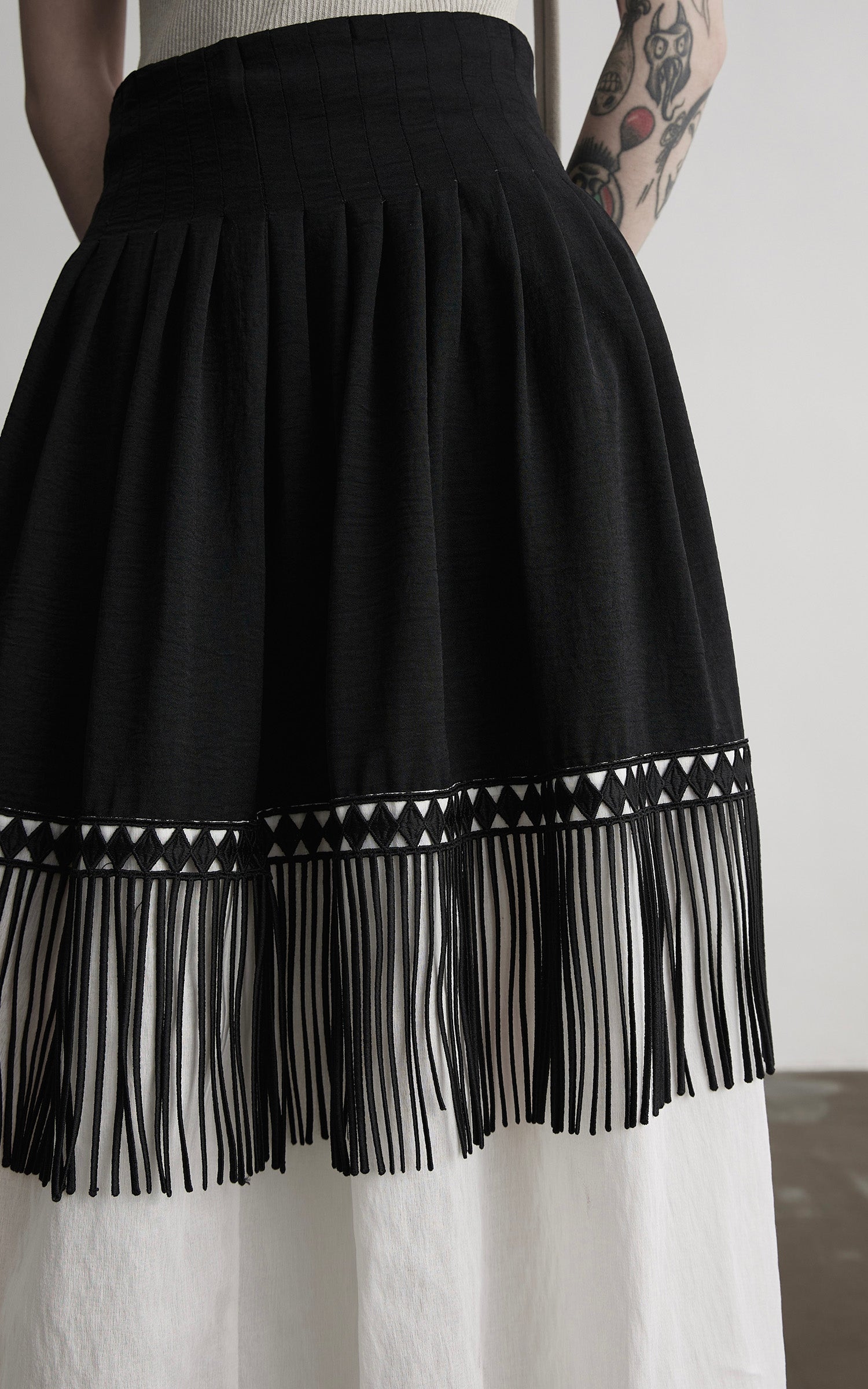 INDULGE Fringe Paneled Layered Skirt with Pleats and Contrast Hem