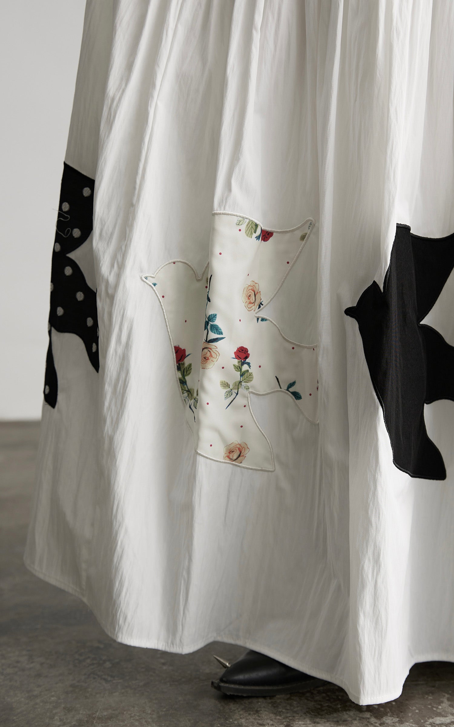 INDULGE Bird Patch Panel Maxi Skirt with Raw Volume Silhouette