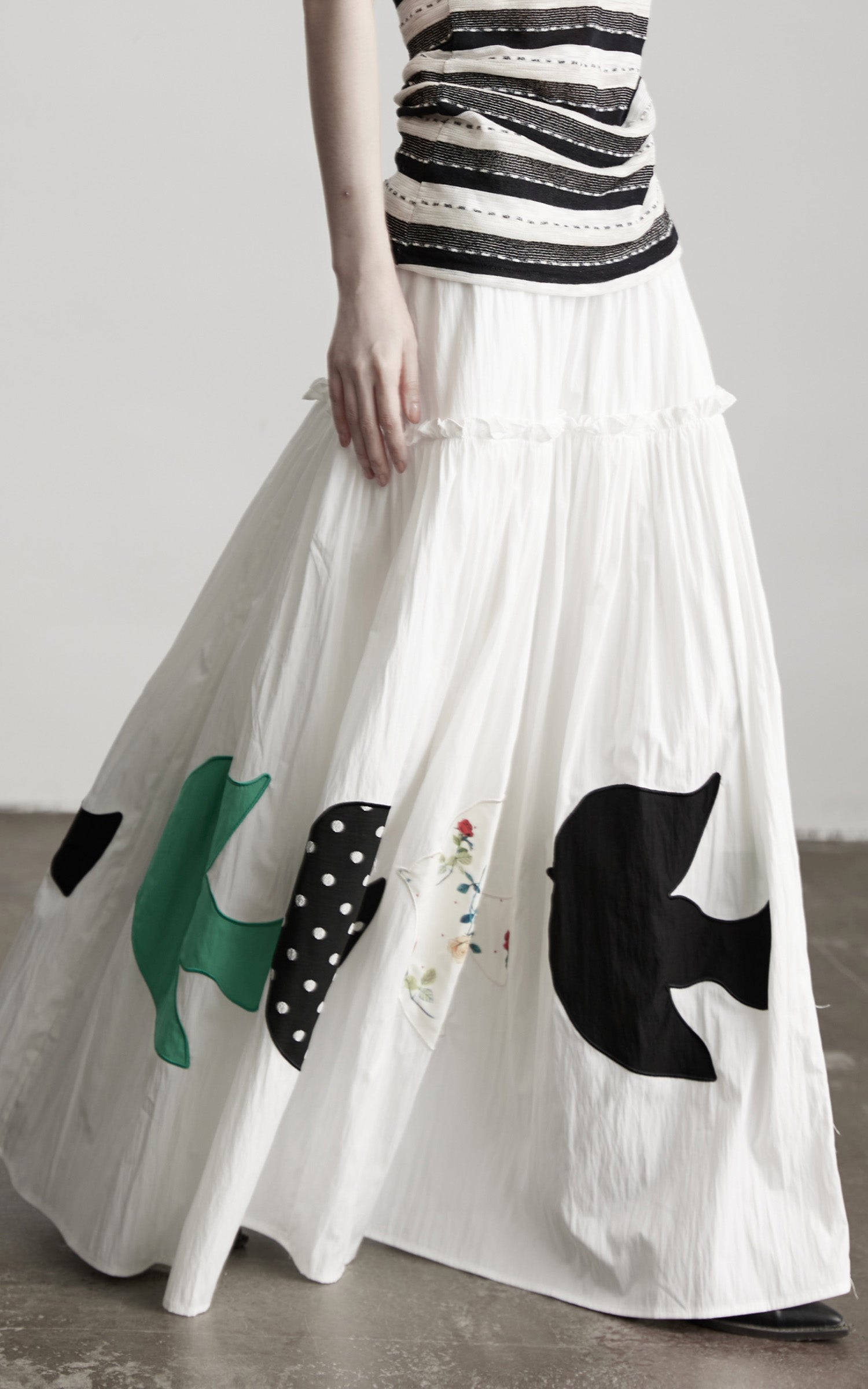 INDULGE Bird Patch Panel Maxi Skirt with Raw Volume Silhouette