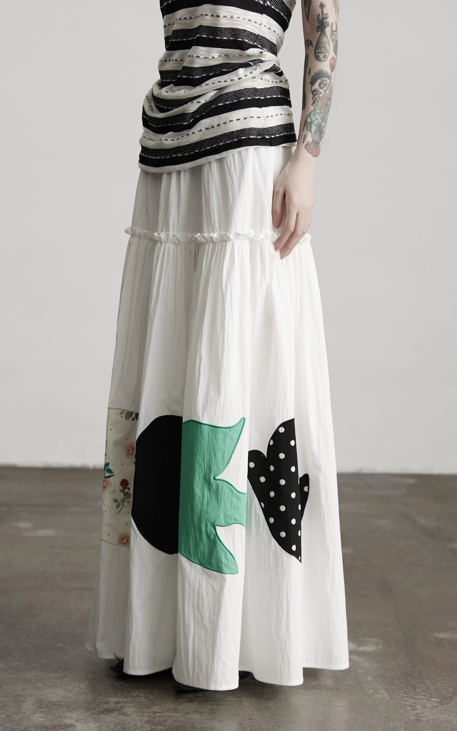 INDULGE Bird Patch Panel Maxi Skirt with Raw Volume Silhouette