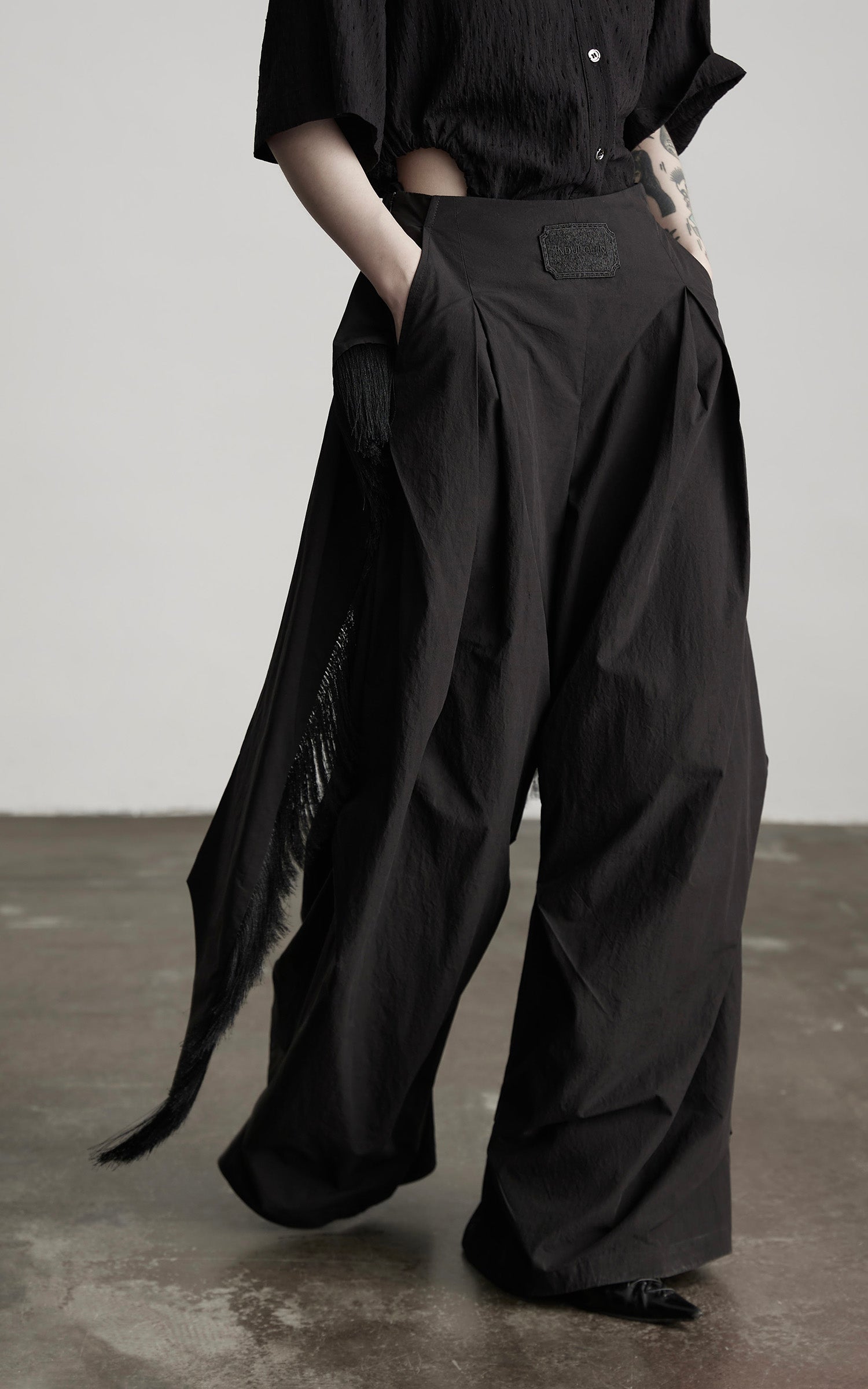 INDULGE Wide-Leg Draped Pants with Fringed Panels and Deconstructed Details