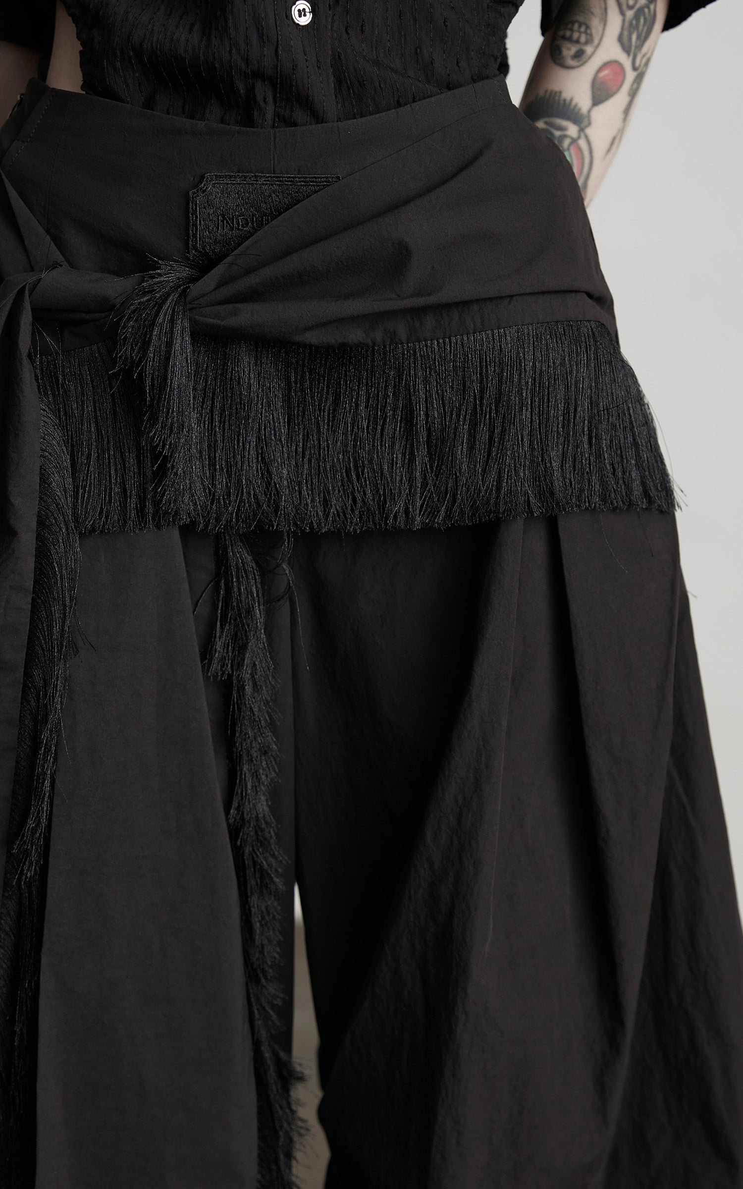 INDULGE Wide-Leg Draped Pants with Fringed Panels and Deconstructed Details
