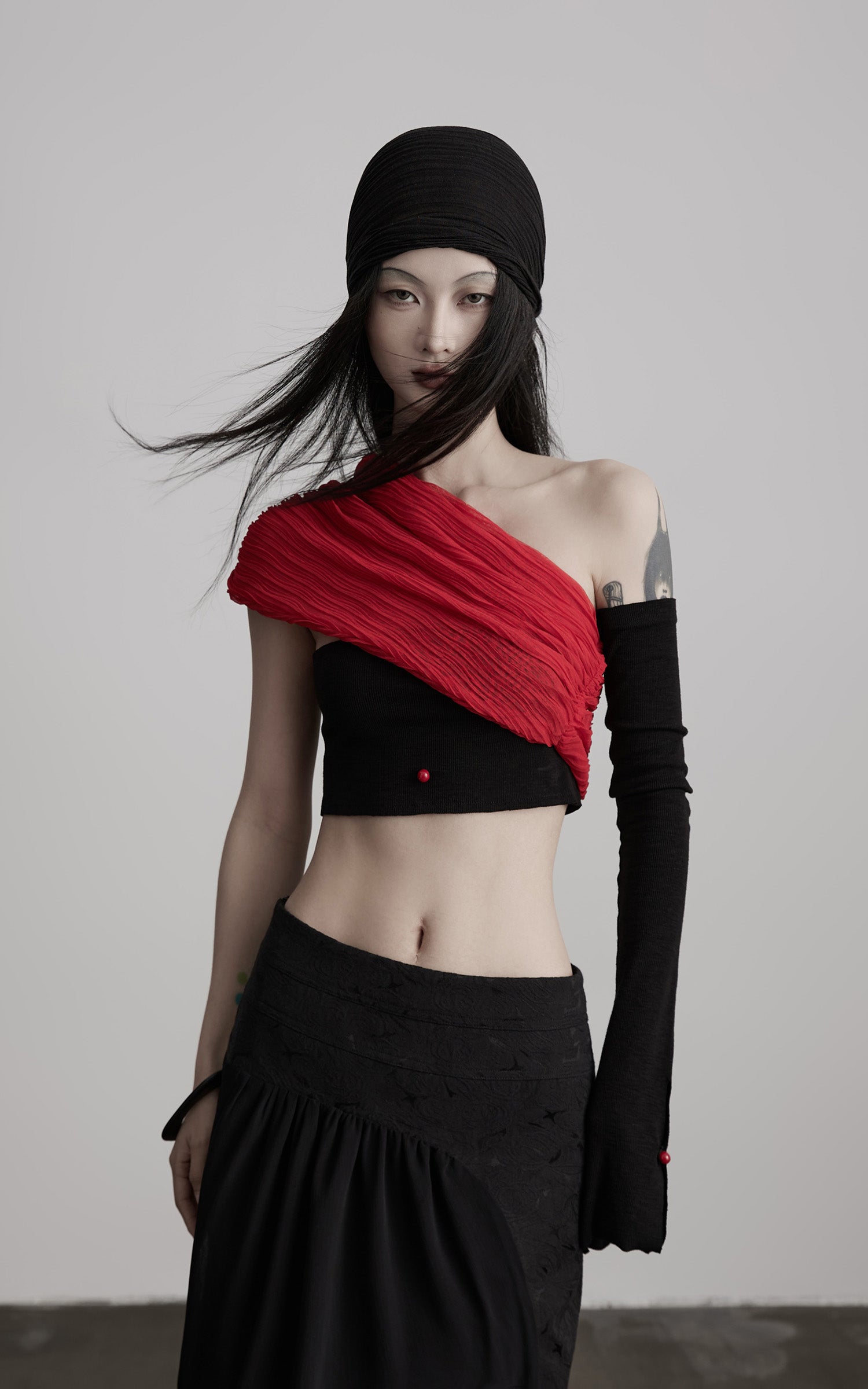 INDULGE Asymmetric Drape Top — Sculptural Red Pleats with Black Knit Base