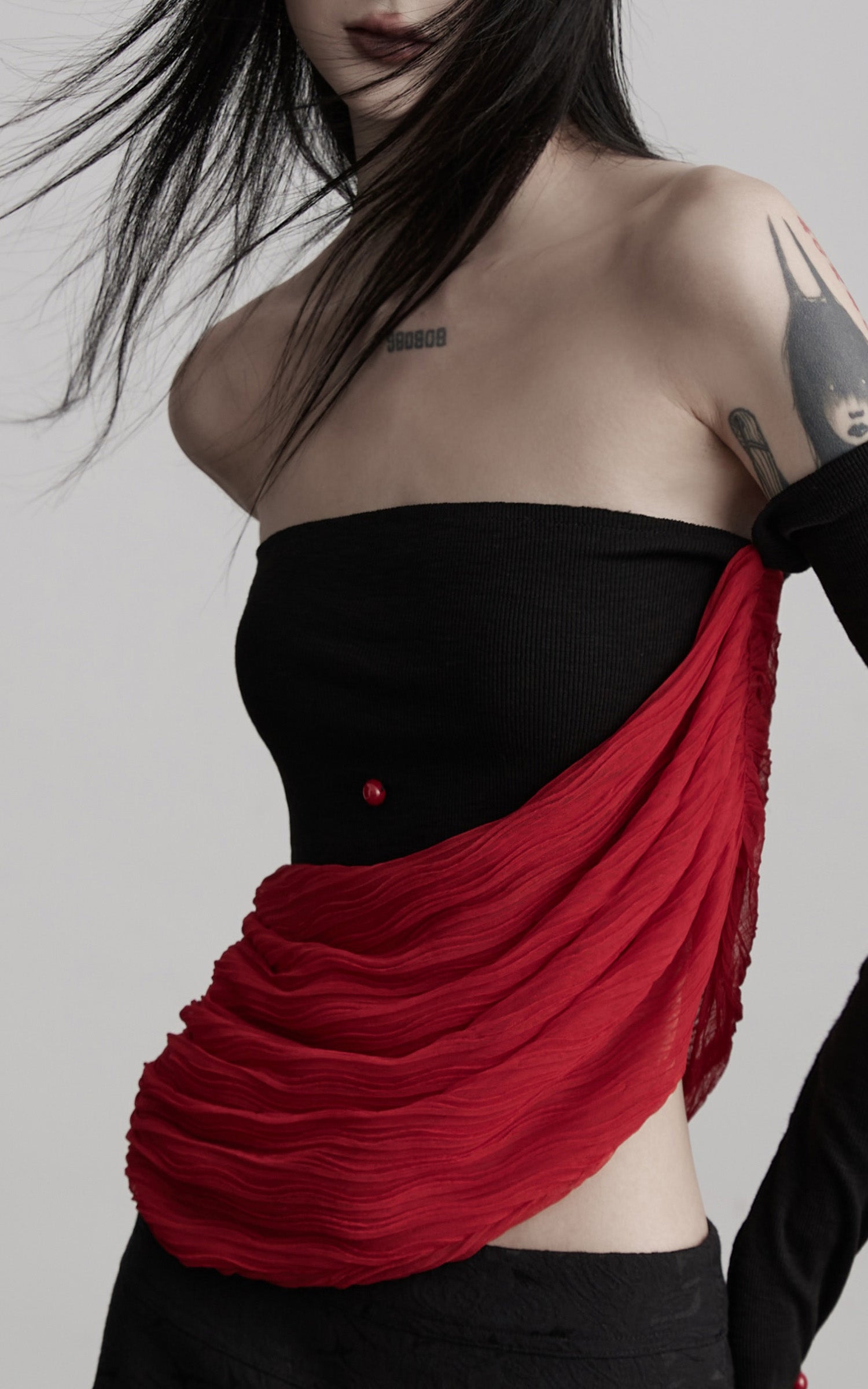 INDULGE Asymmetric Drape Top — Sculptural Red Pleats with Black Knit Base