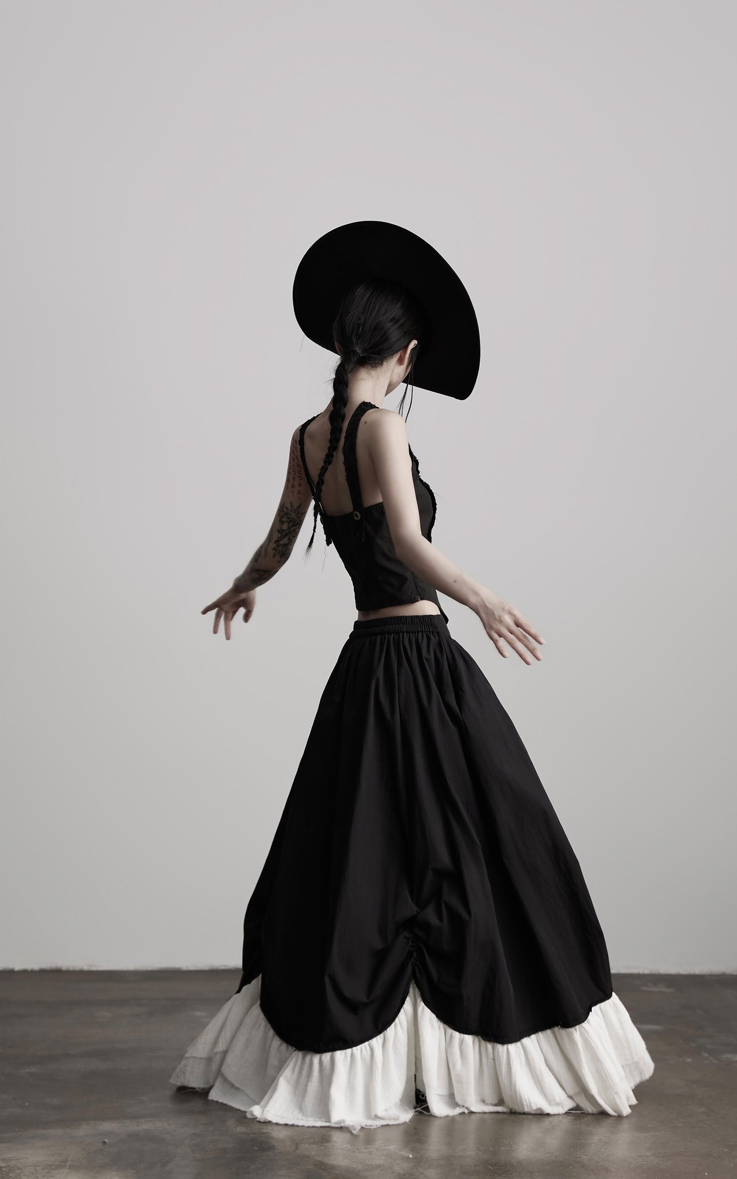 INDULGE Layered Contrast Hem Skirt with Gathered Draping and Buttoned High Waist