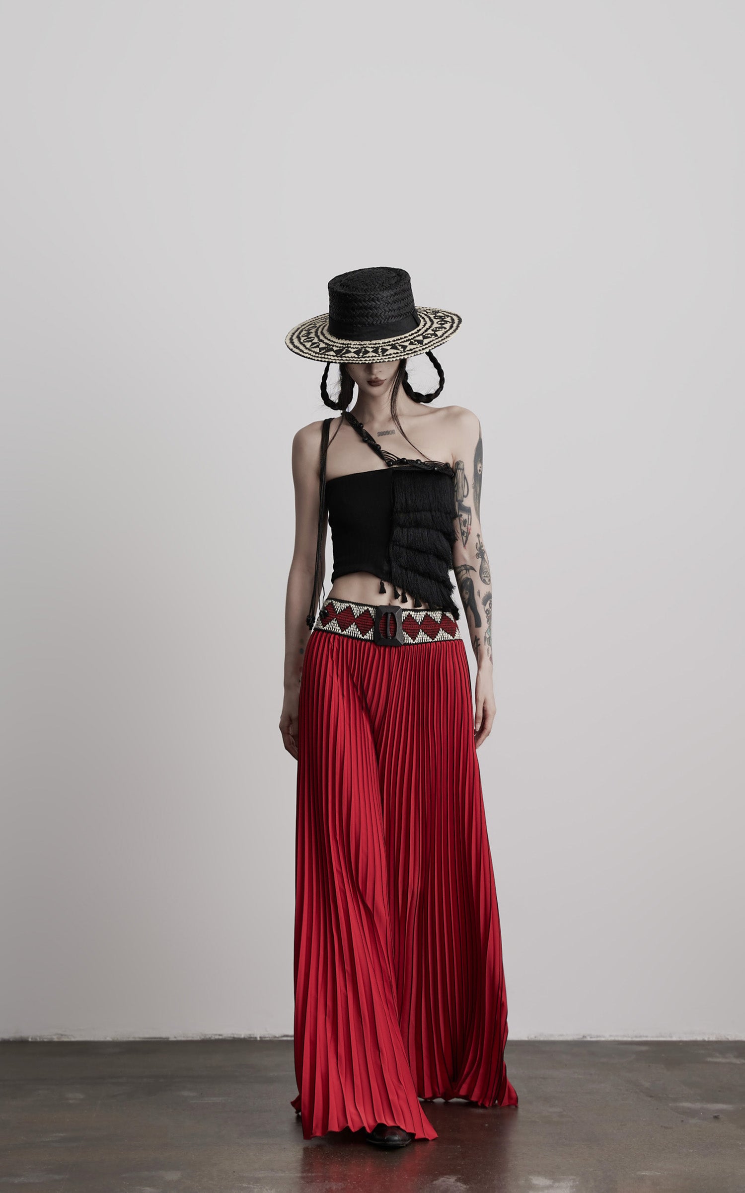INDULGE Red Pleated Wide-Leg Skirt with Geometric Woven Waistband and Statement Buckle
