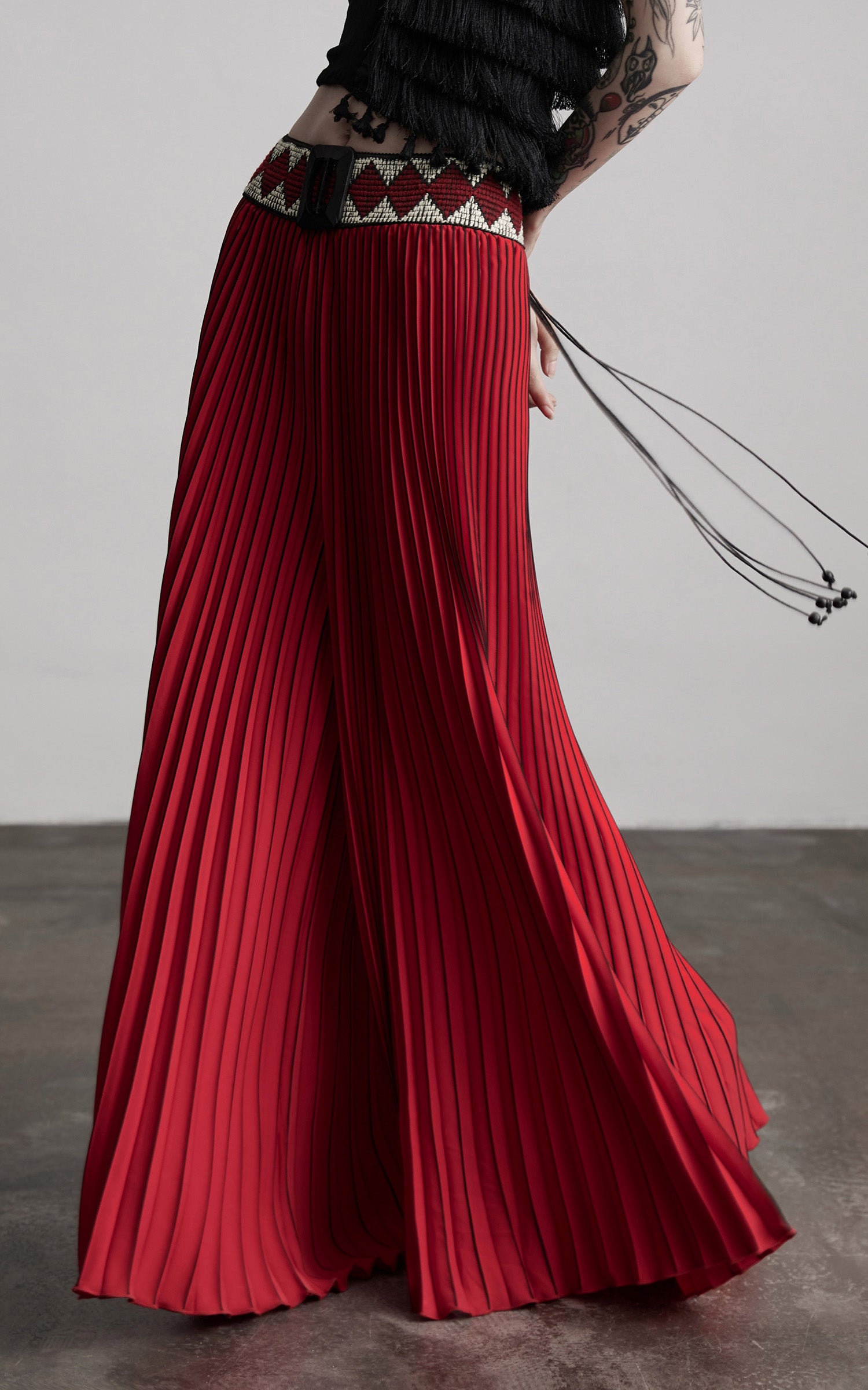 INDULGE Red Pleated Wide-Leg Skirt with Geometric Woven Waistband and Statement Buckle