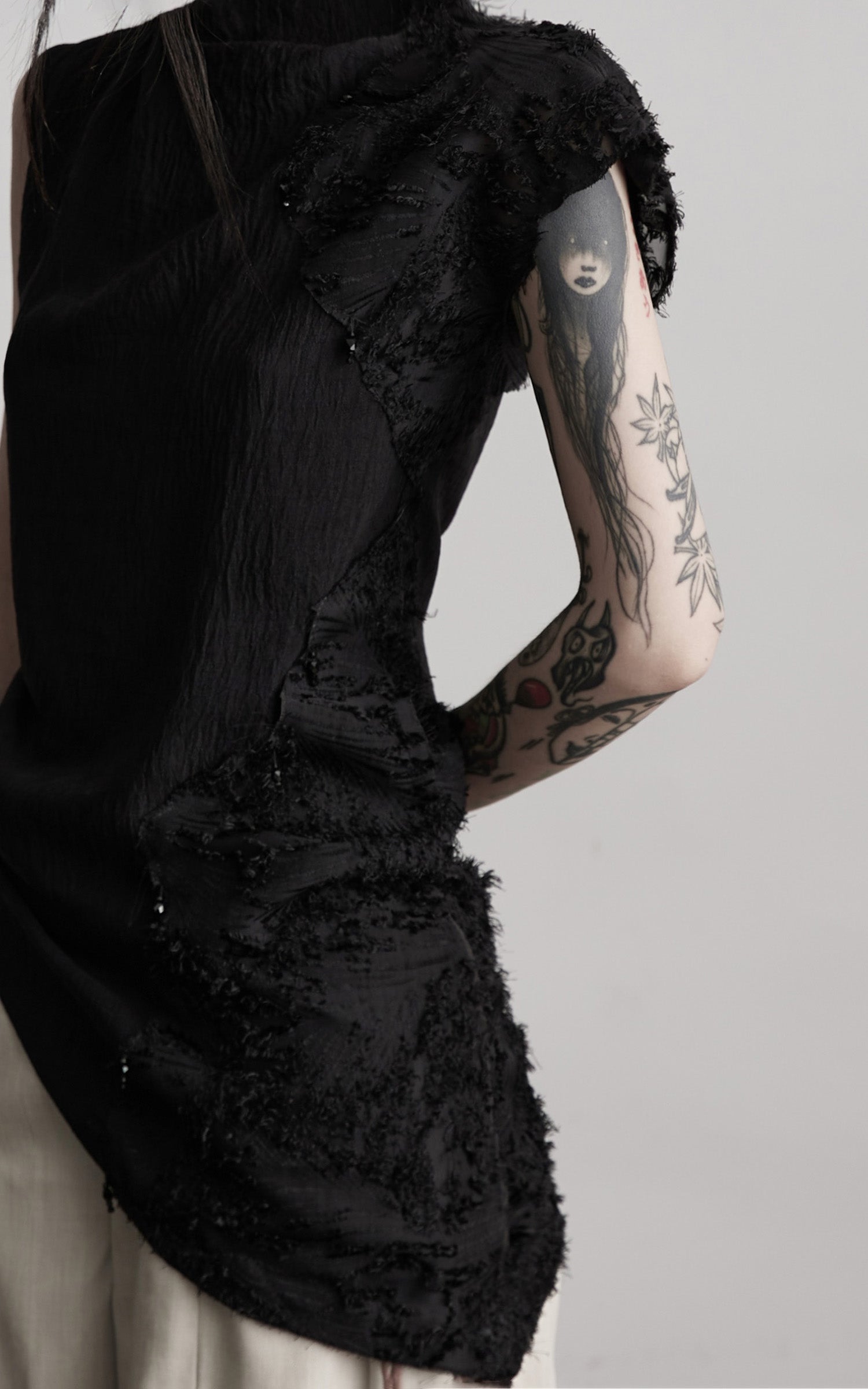 INDULGE Asymmetric Textured Sleeveless Top with Frayed and Beaded Detailing
