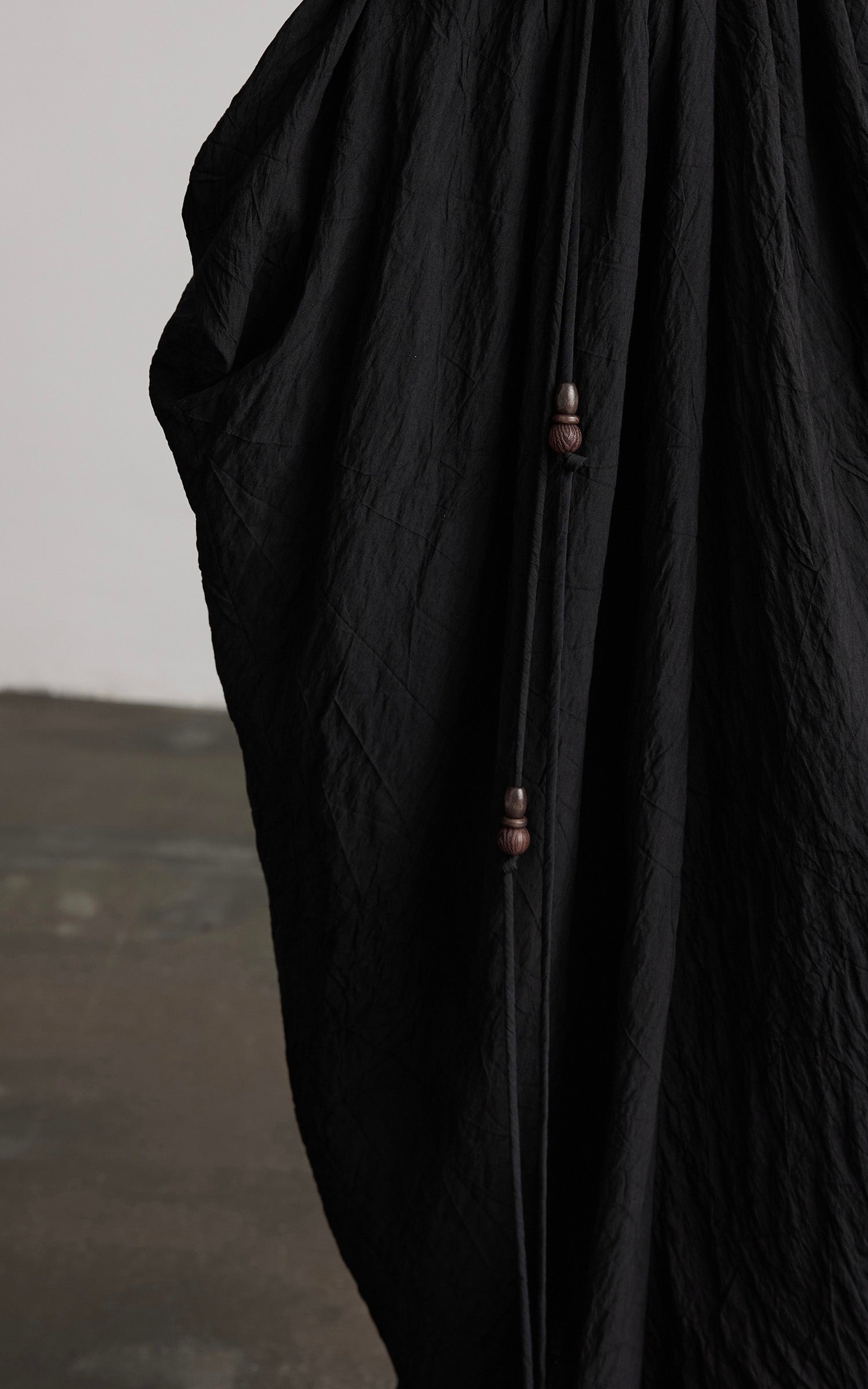 INDULGE Asymmetric Draped Maxi Dress with Textured Fabric and Wooden Bead Detail