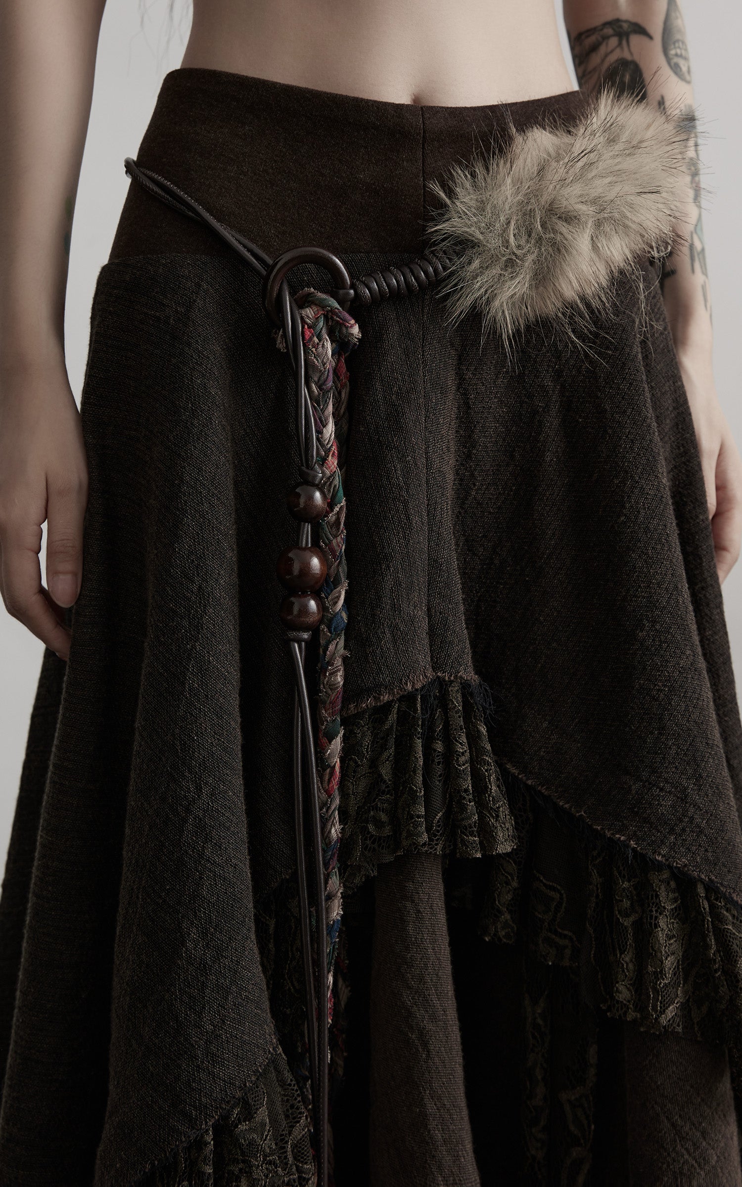 INDULGE Layered Asymmetric Skirt with Braided Belt and Fur Accent