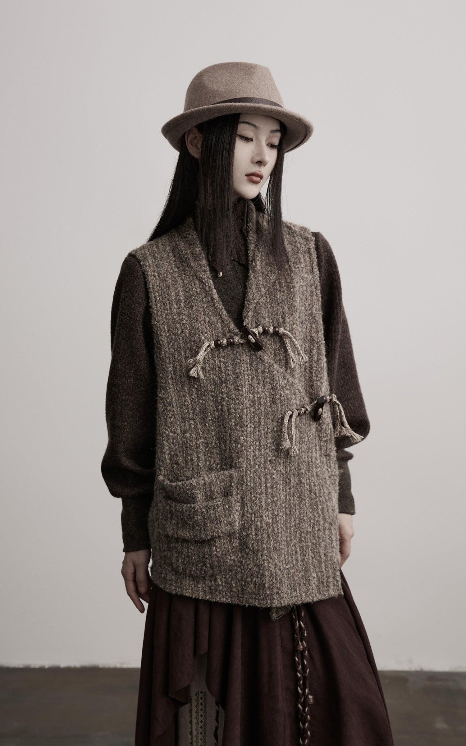 INDULGE Textured Wool Vest with Asymmetric Panels and Hand-Tied Toggle Details