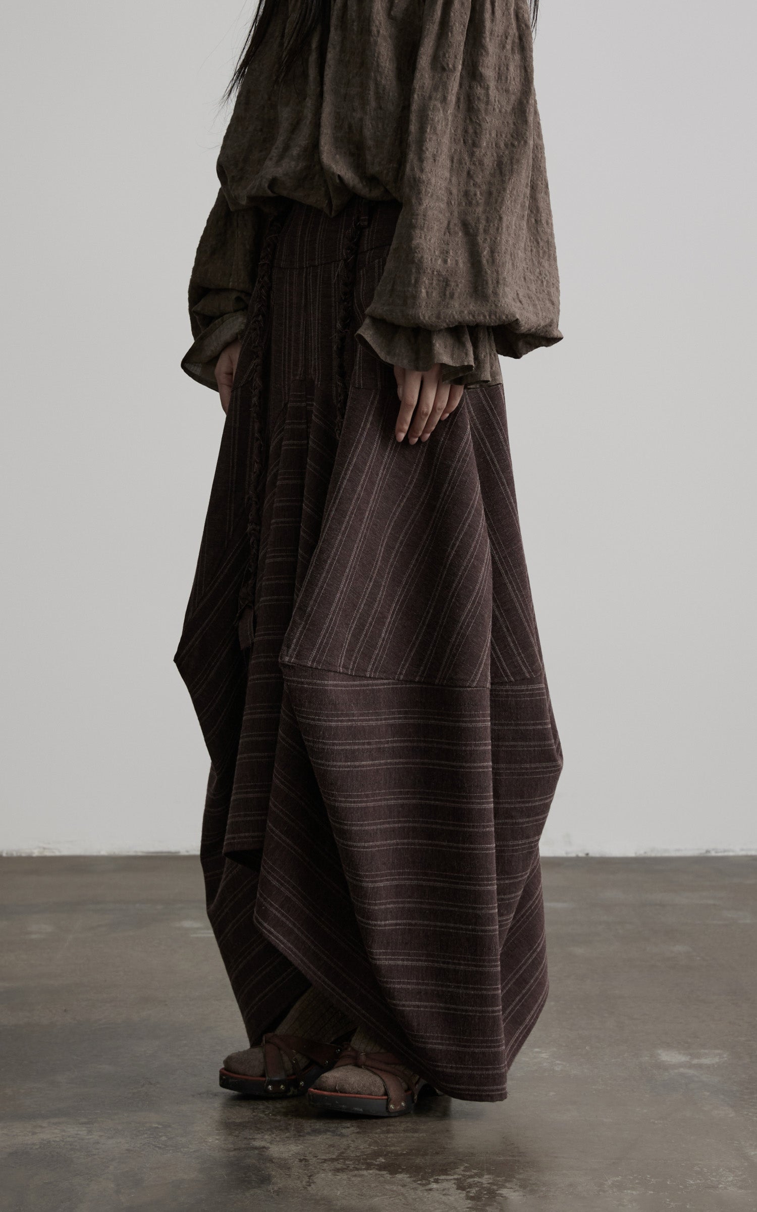 DOINDULGE Shadow Stripe Asymmetric Draped Skirt with Raw Braided Details