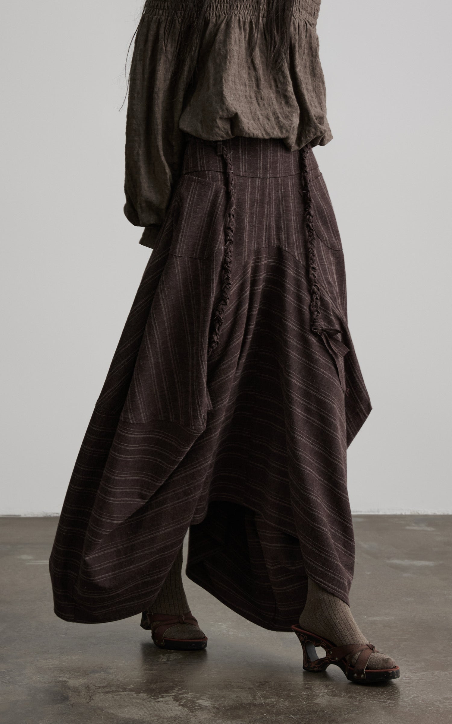 DOINDULGE Shadow Stripe Asymmetric Draped Skirt with Raw Braided Details