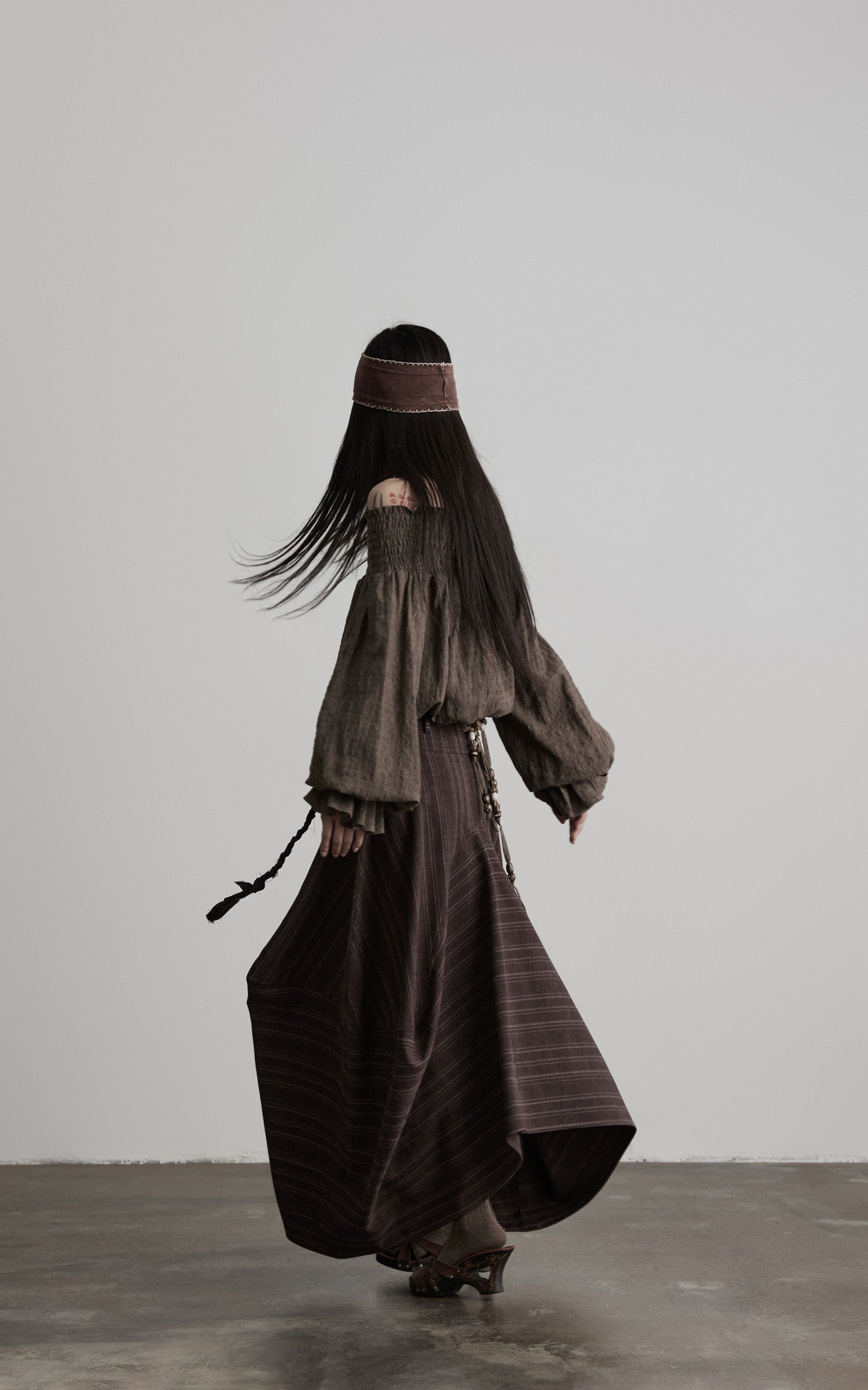 DOINDULGE Shadow Stripe Asymmetric Draped Skirt with Raw Braided Details