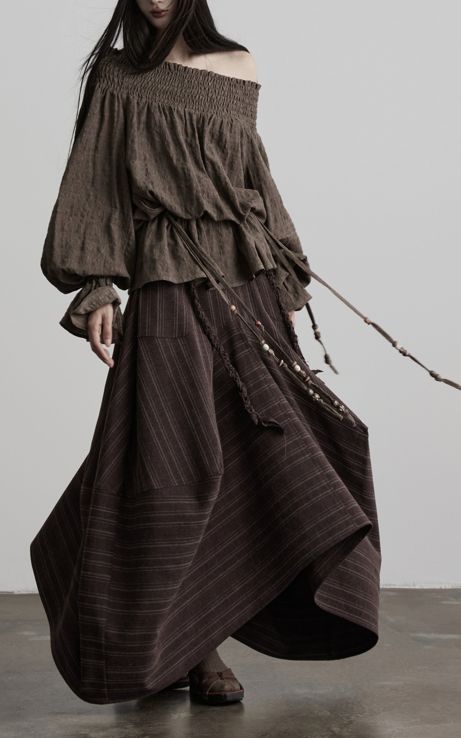 DOINDULGE Shadow Stripe Asymmetric Draped Skirt with Raw Braided Details