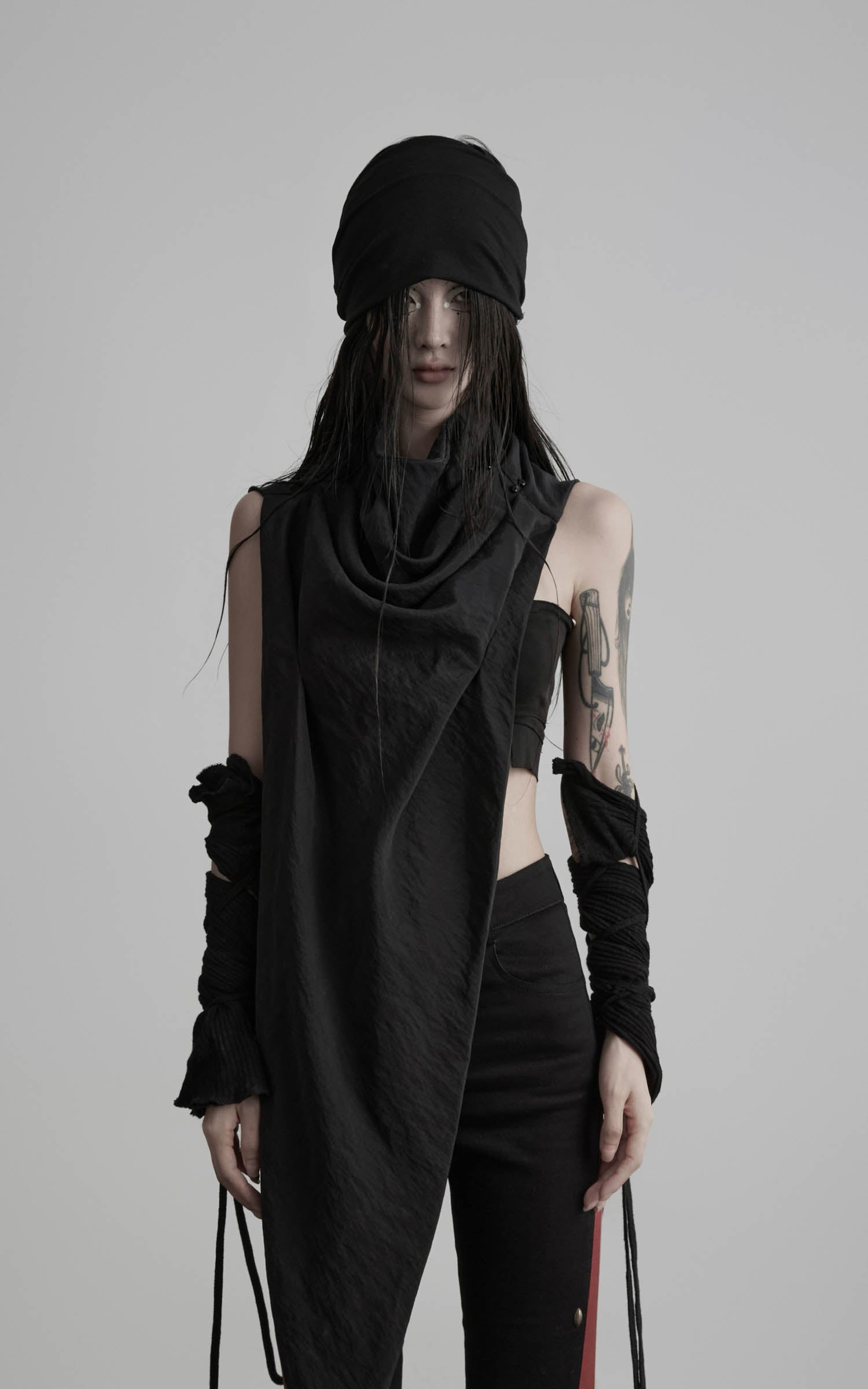 Front view of black asymmetric drape scarf shawl with elongated silhouette