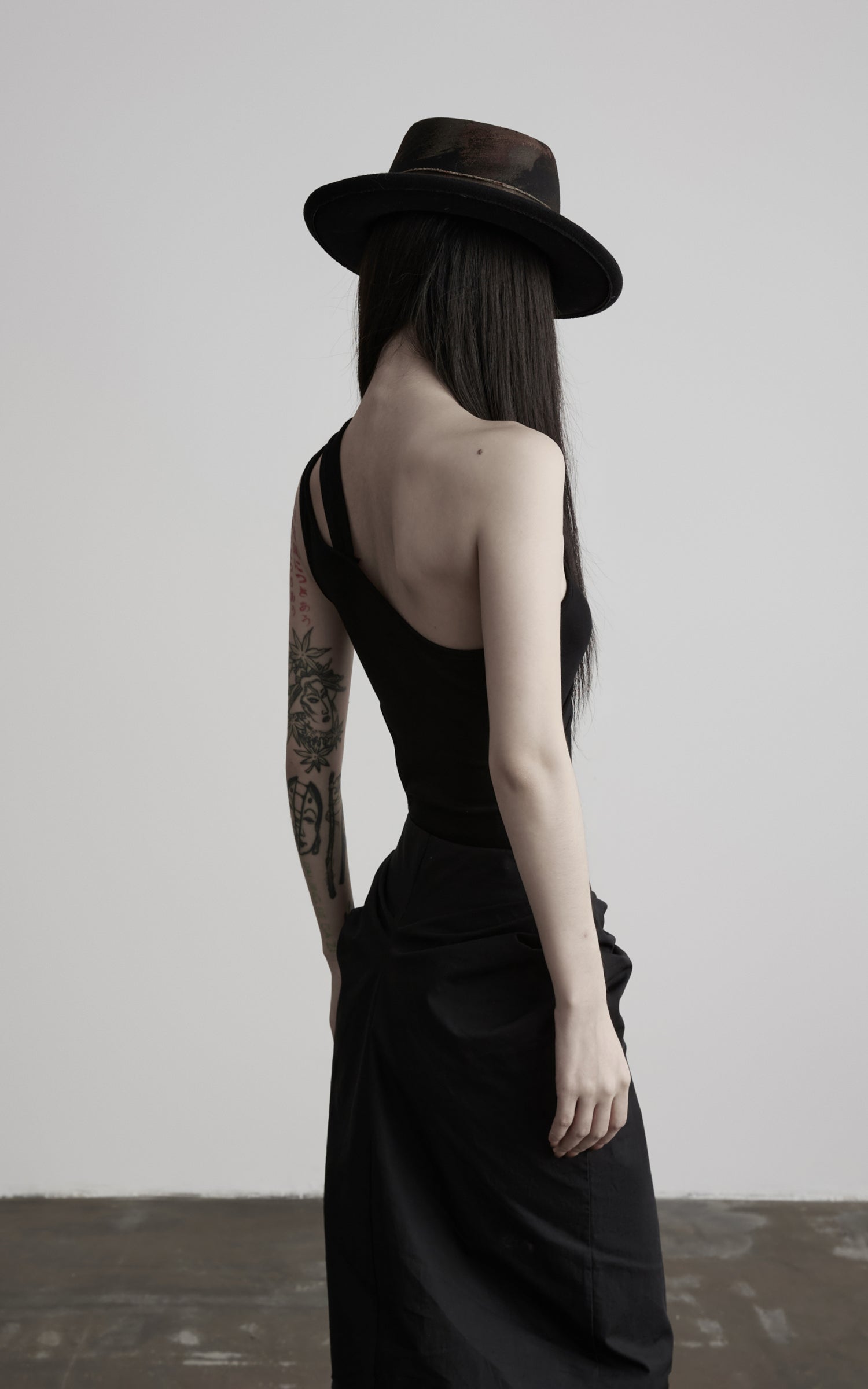 DOINDULGE Asymmetric One-Shoulder Cutout Knit Bodysuit