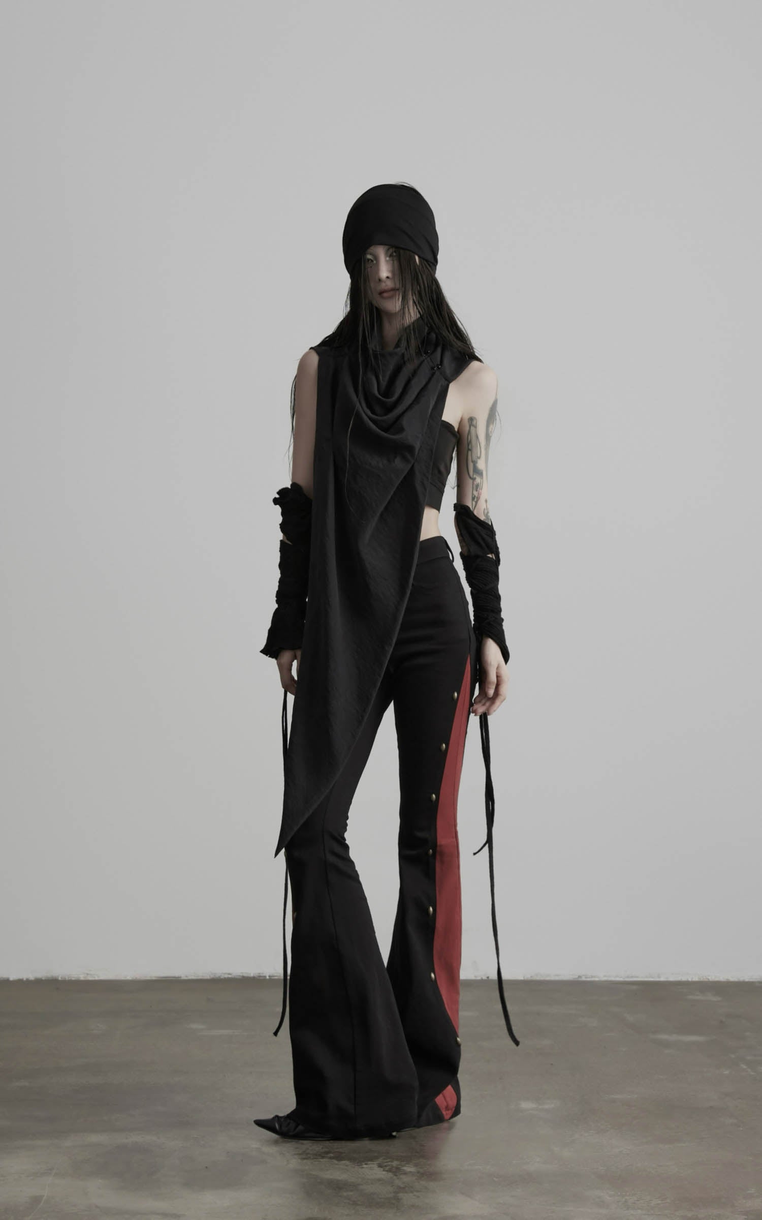 Front view of black asymmetric drape scarf shawl with narrow tapered shape