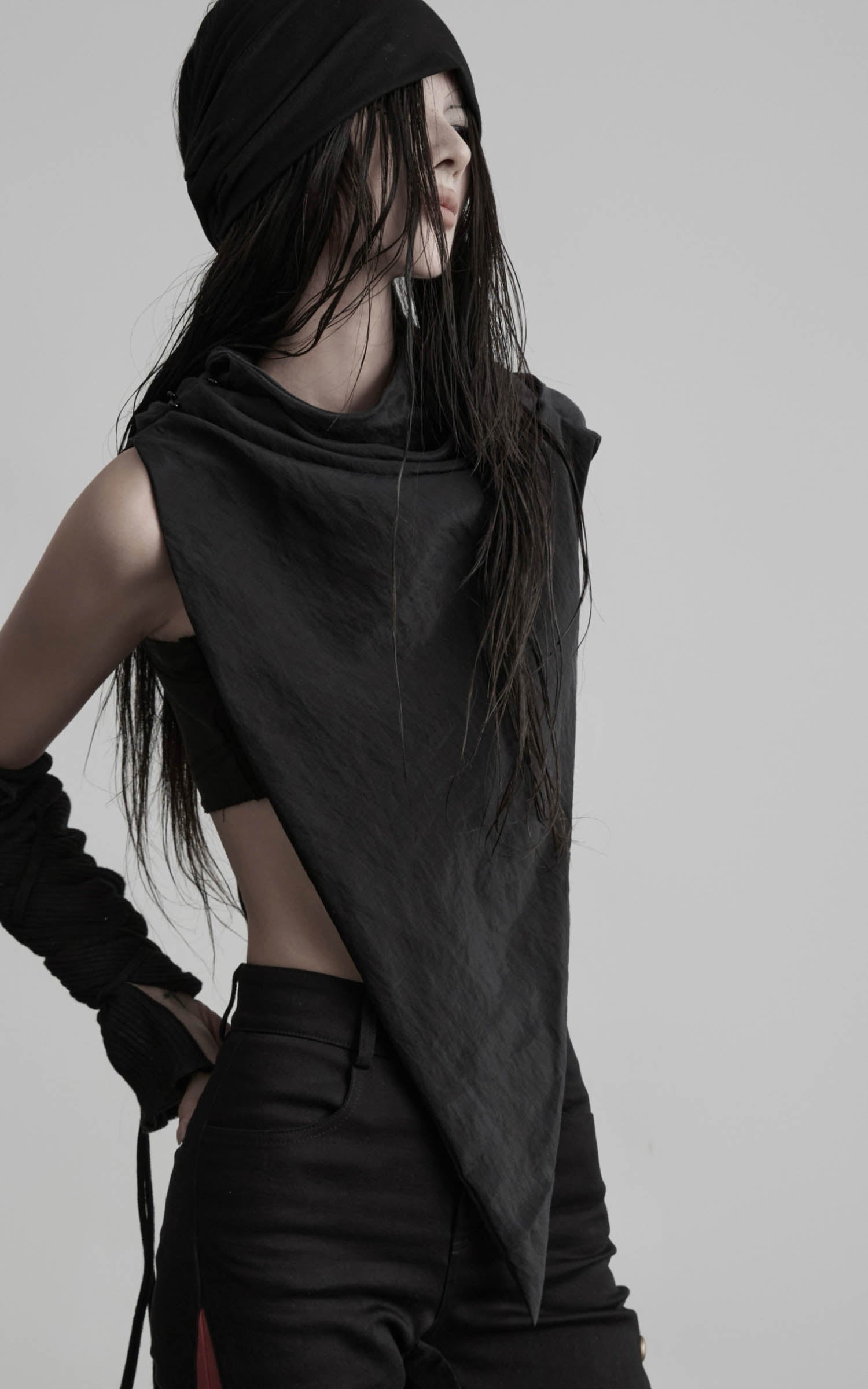 Side view of black asymmetric drape scarf shawl with sculpted draped neckline