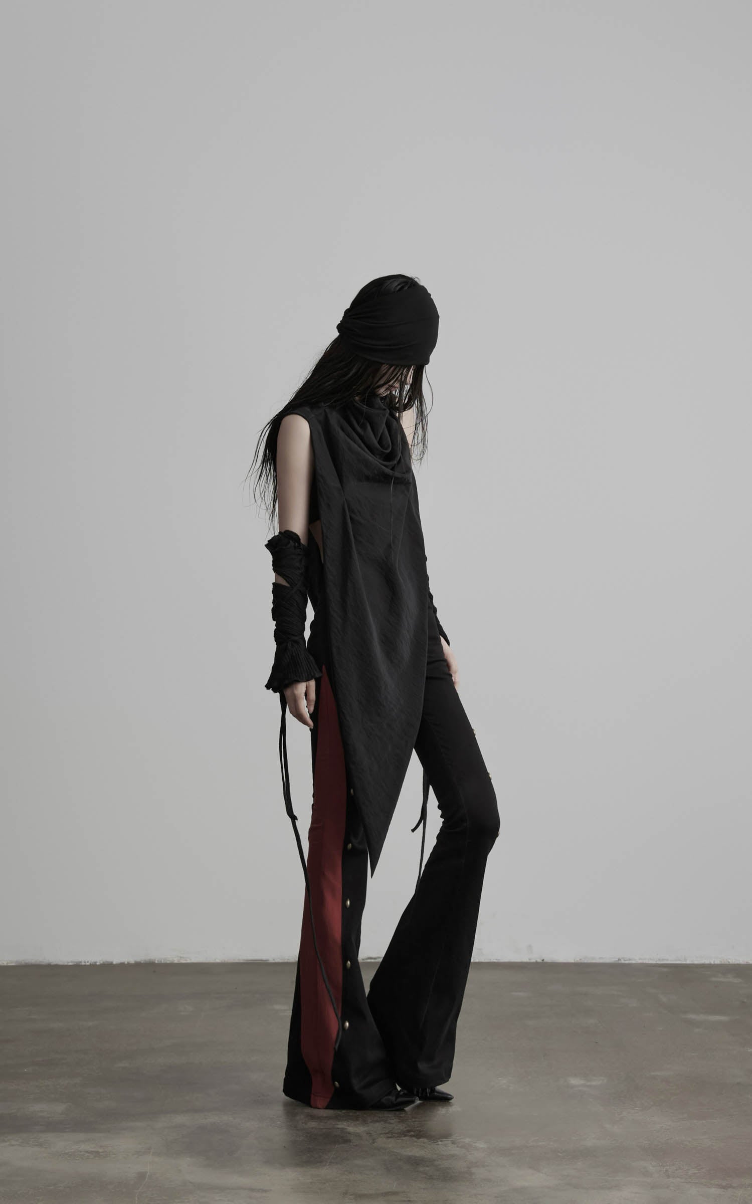 Side view of black asymmetric drape scarf shawl with layered side drape
