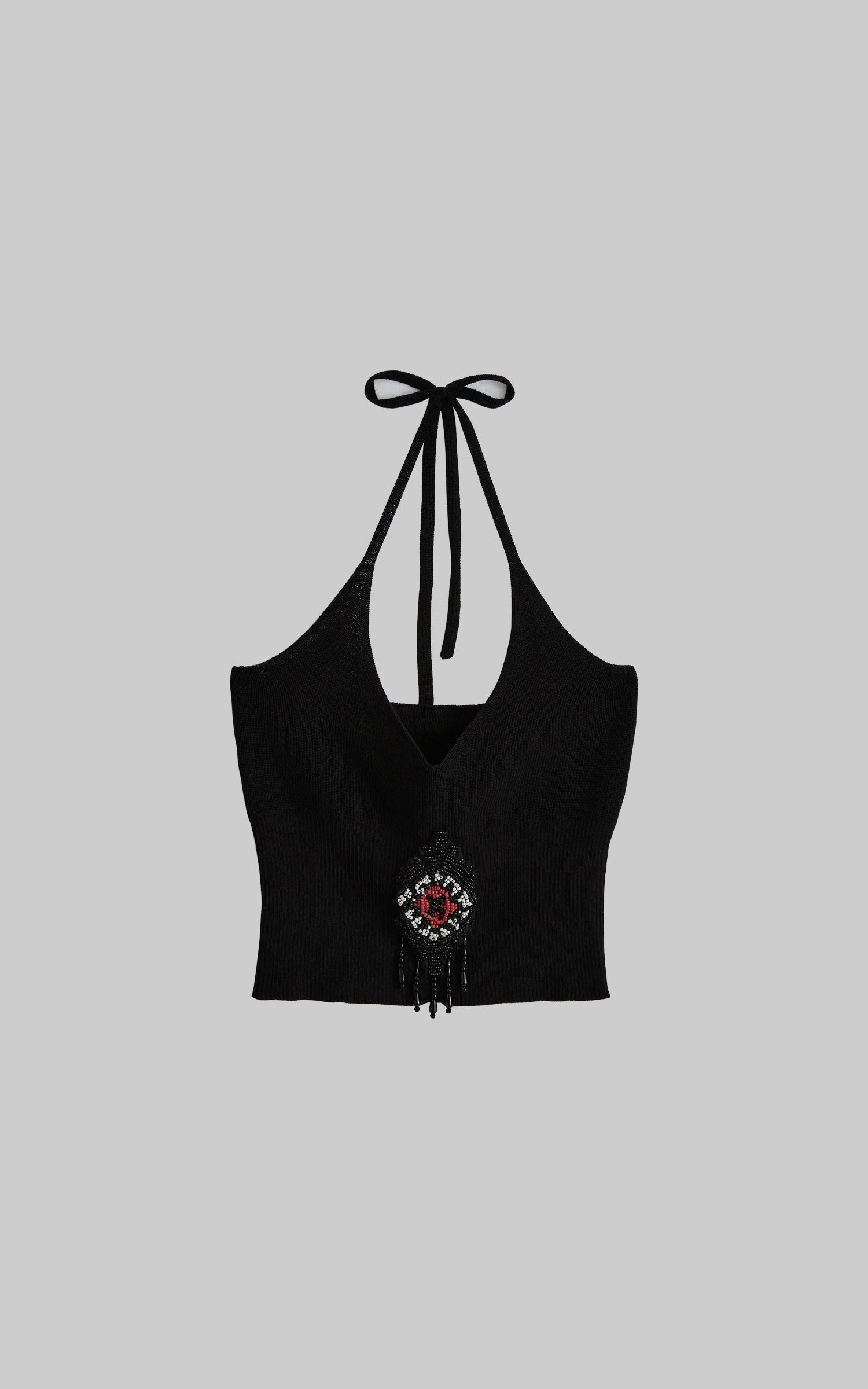 front view of black beaded halter knit top laid flat with tie neck