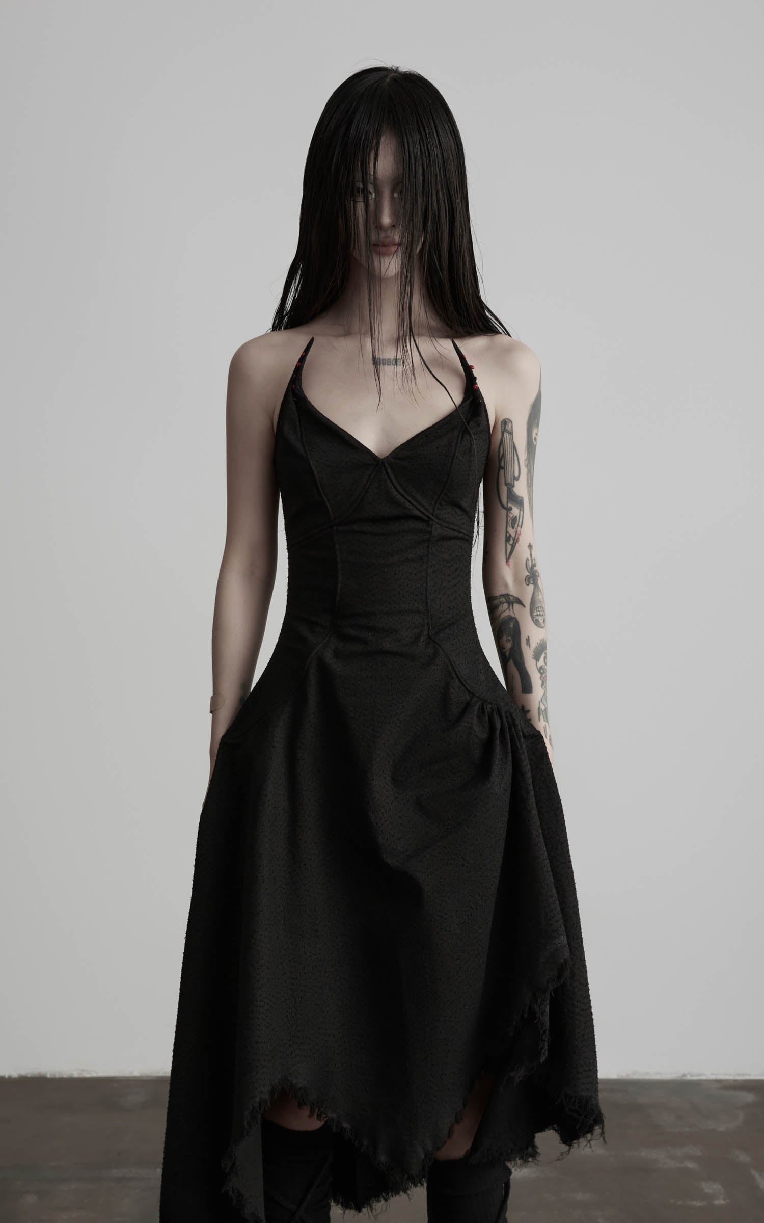 Black cotton bustier dress with raw asymmetric hem front view