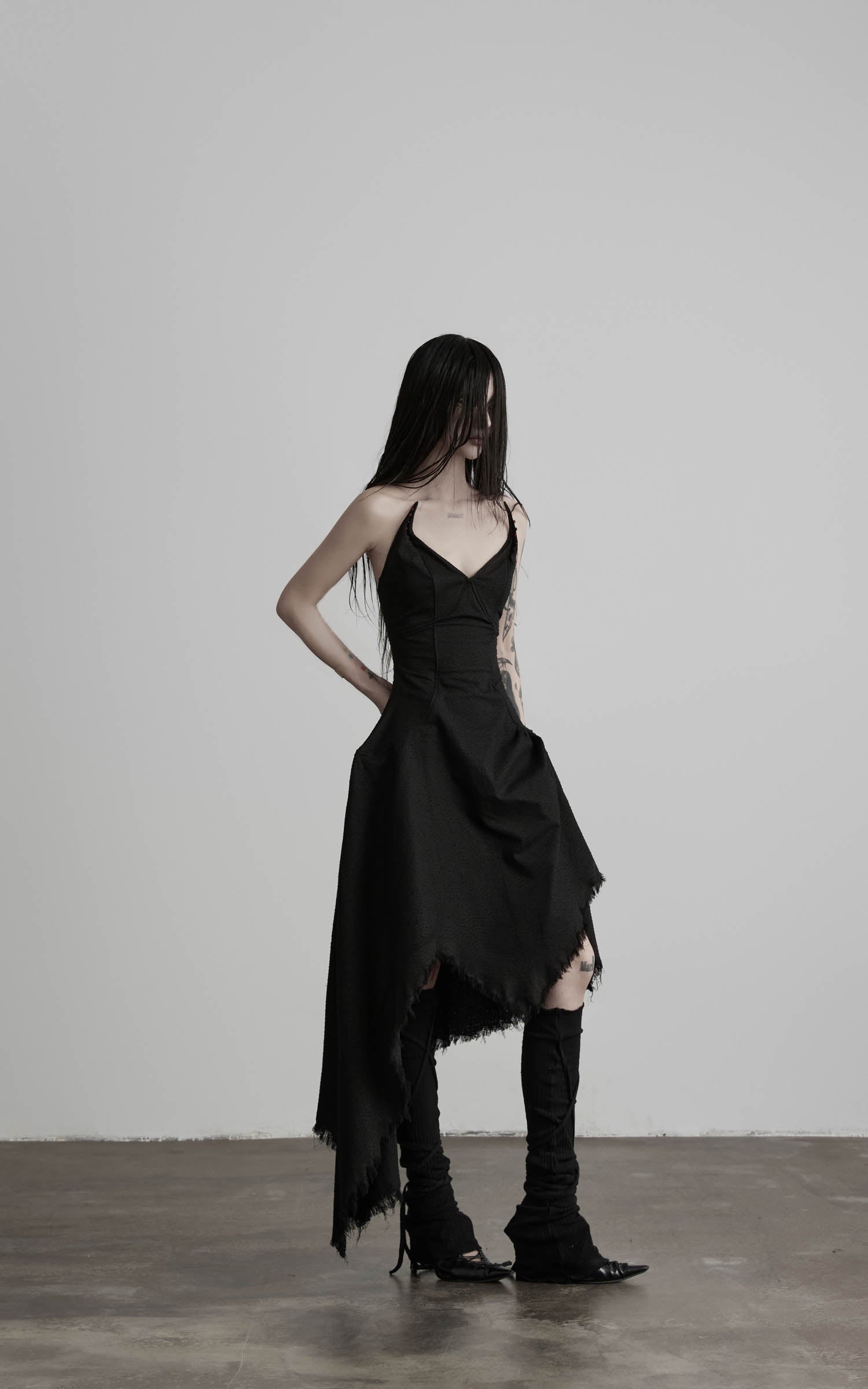 Black cotton bustier dress with high low skirt side view