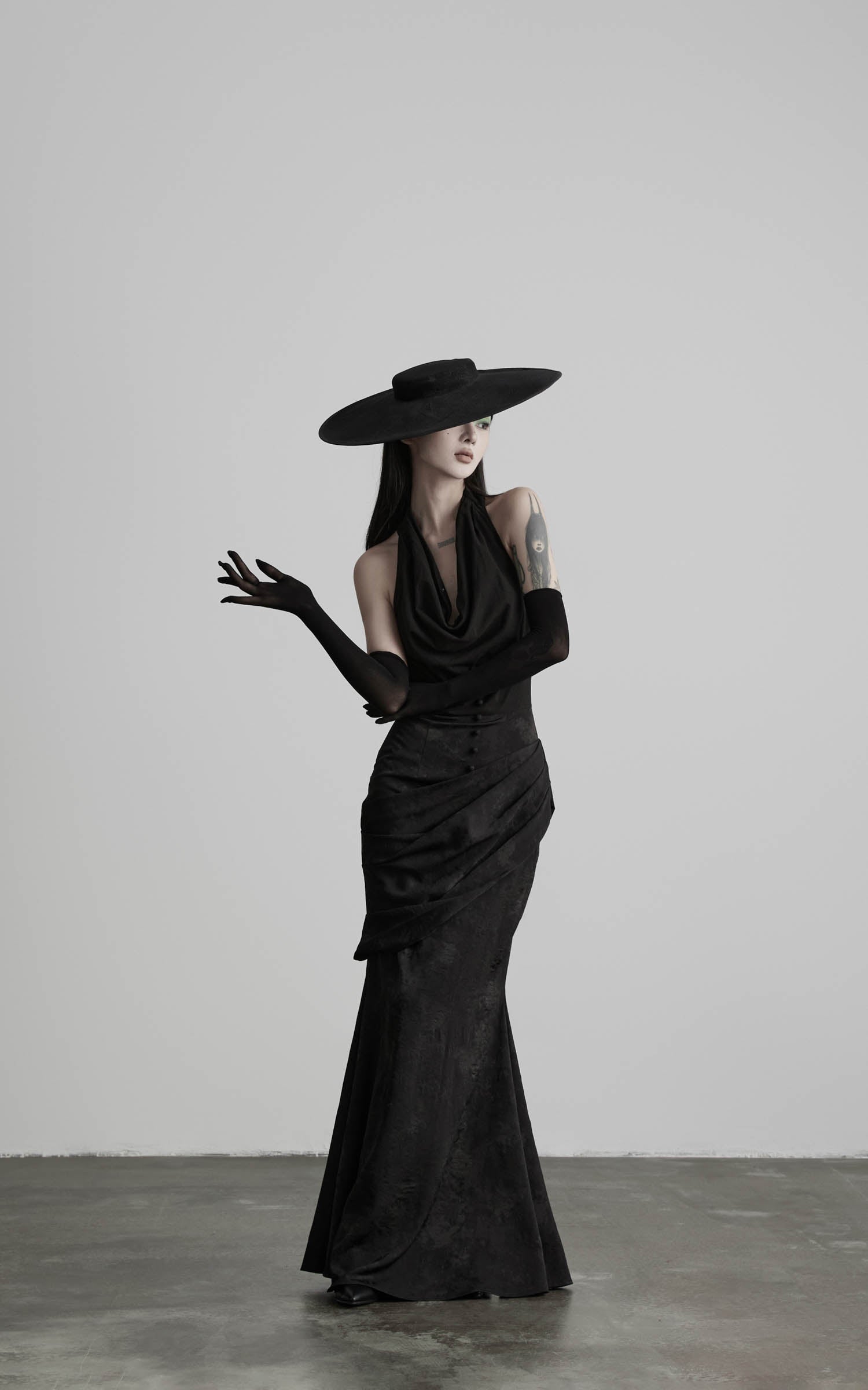 Black halter cowl neck maxi dress upper body detail view