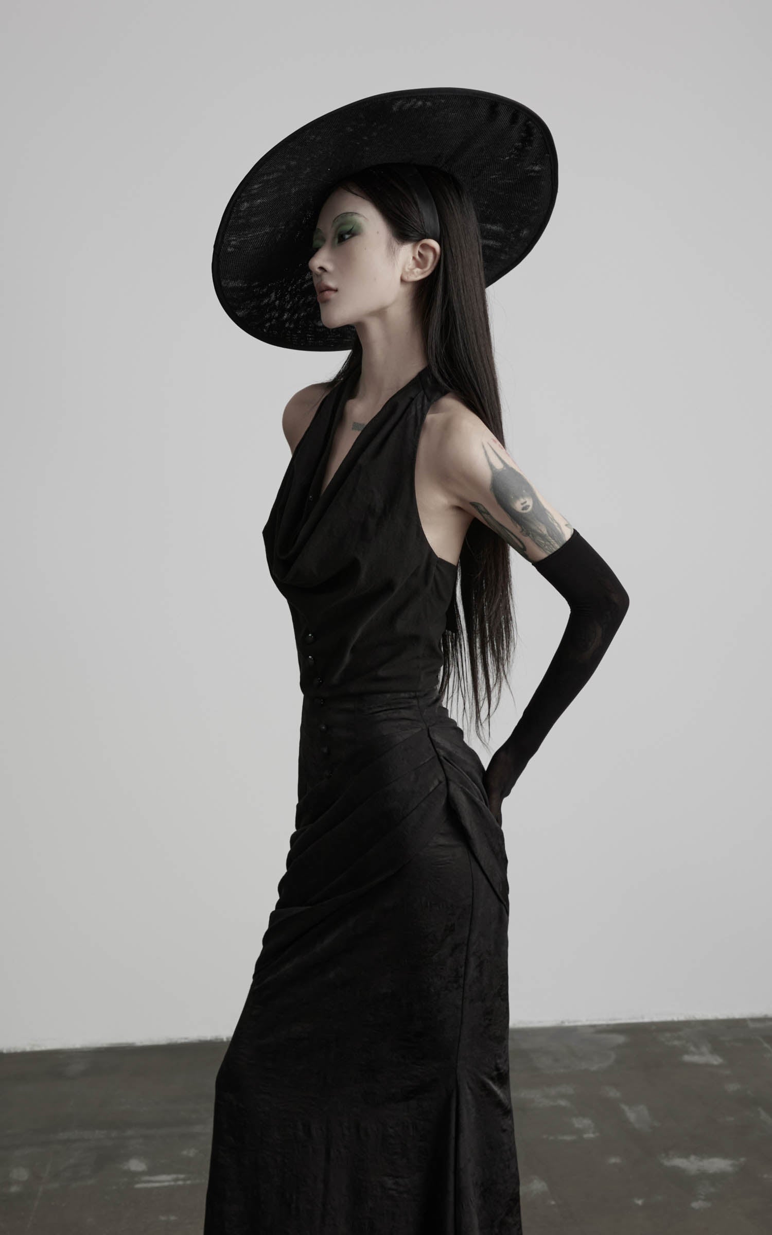 Black halter cowl neck maxi dress side upper body view