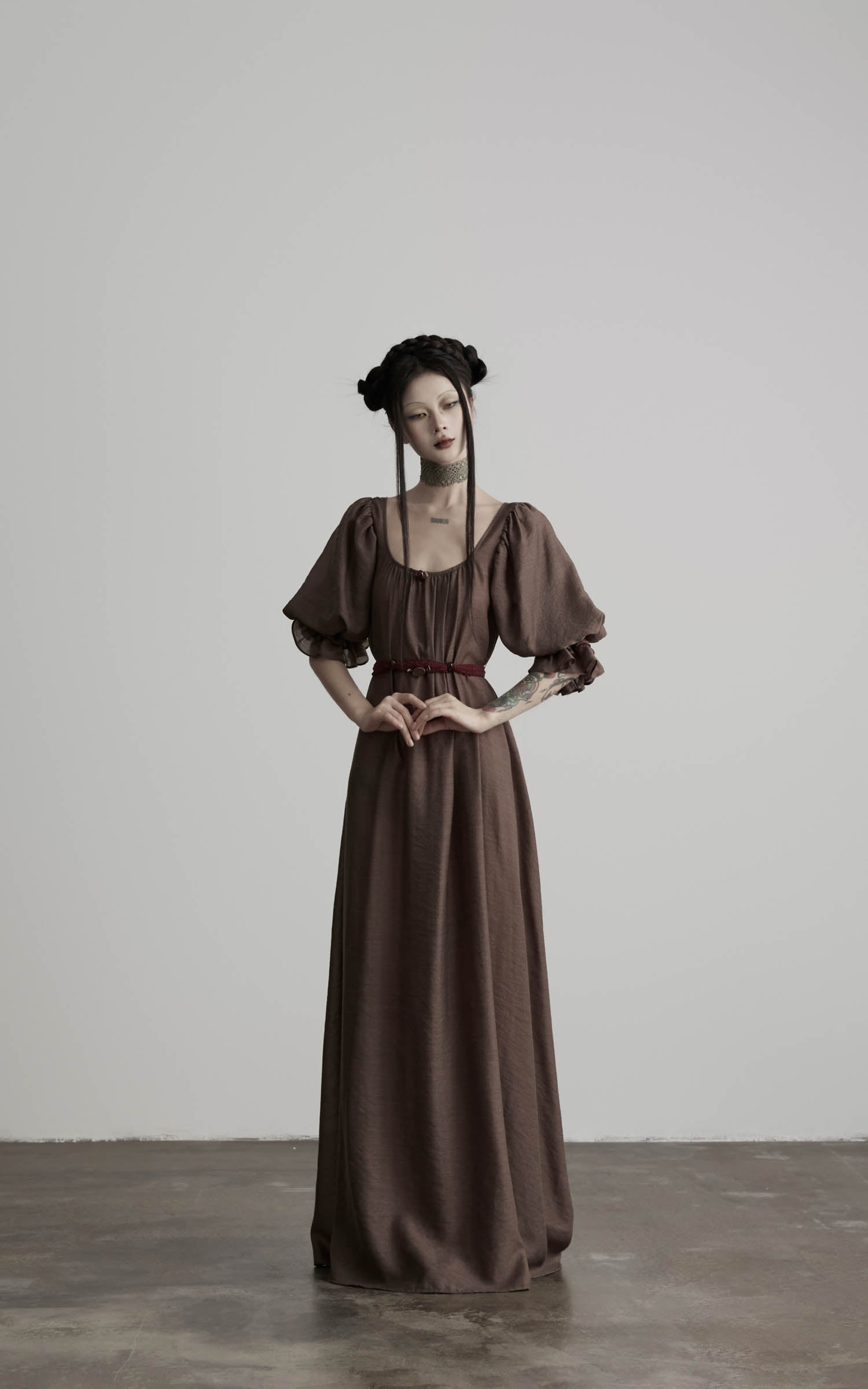 front view of brown maxi dress with relaxed silhouette and belt