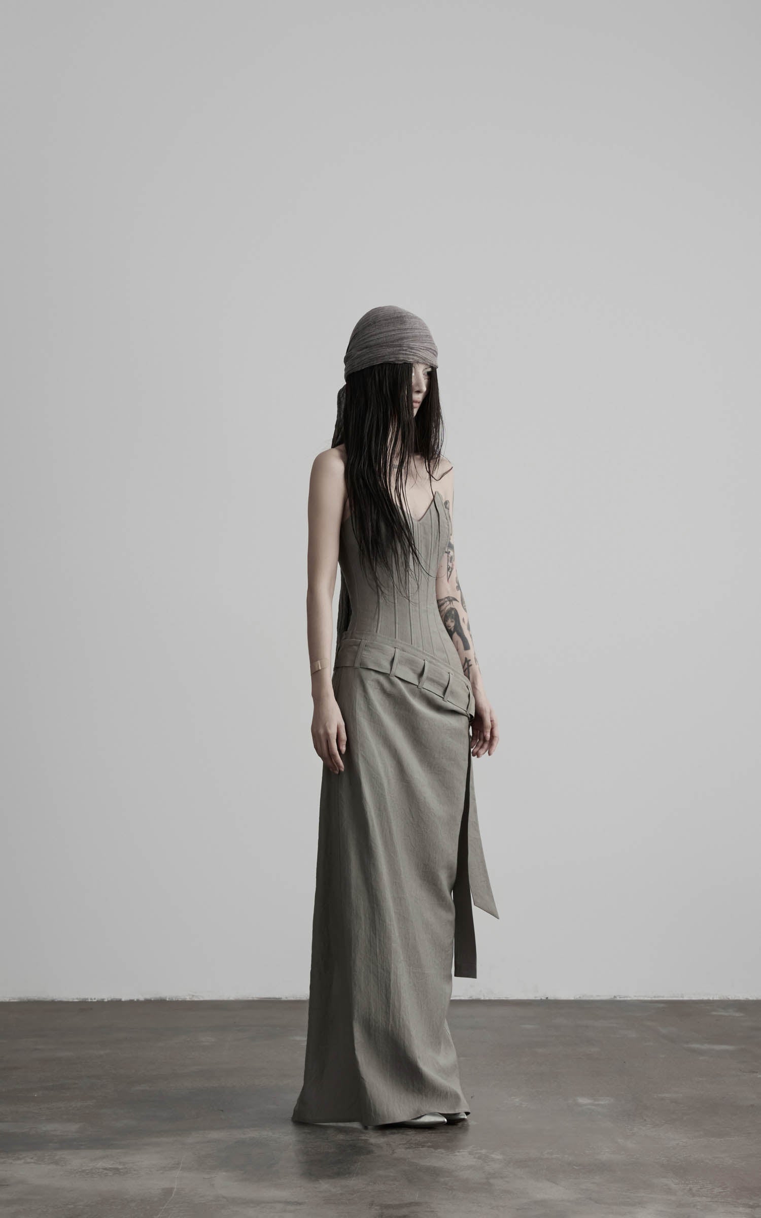 Gray corset wrap maxi dress with side wrap panel angled view
