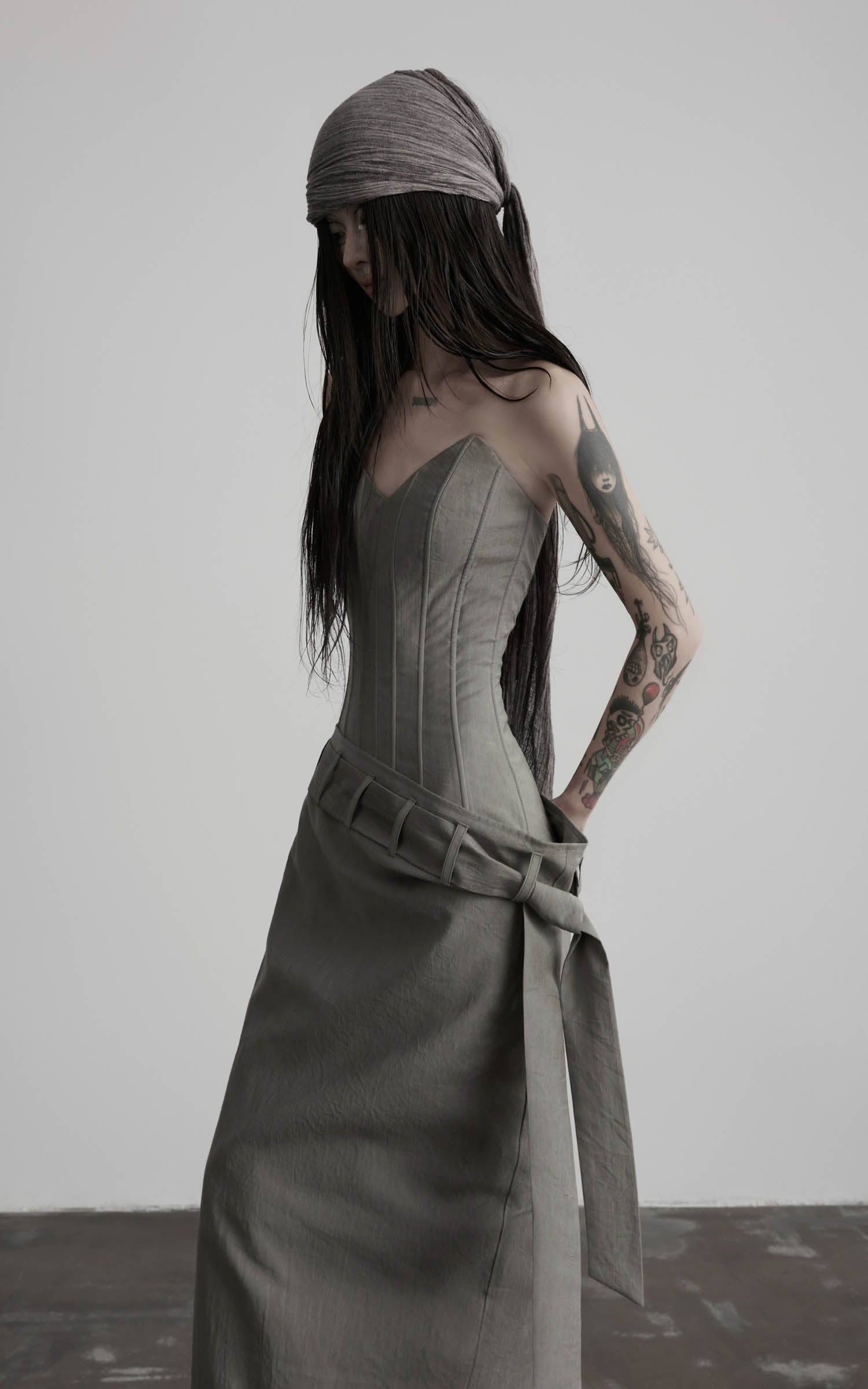 Gray corset wrap maxi dress with paneled bodice seams side view