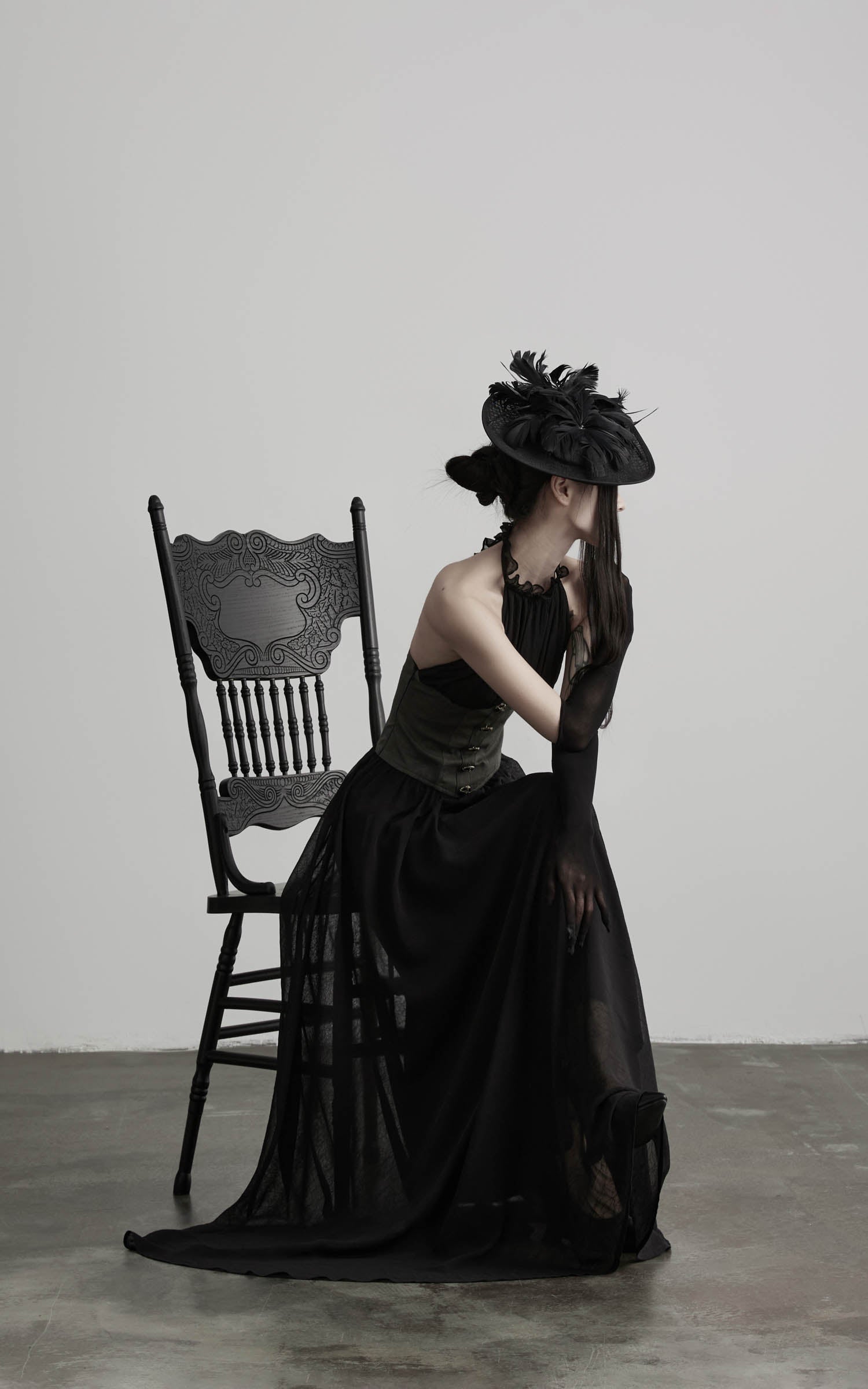 Black gathered halter corset maxi dress with sheer layered skirt side view