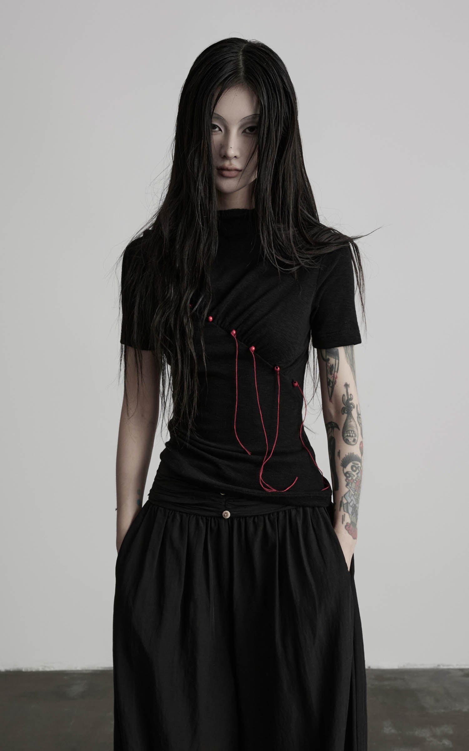 Black mock neck ruched knit T-shirt with asymmetric ruched front view