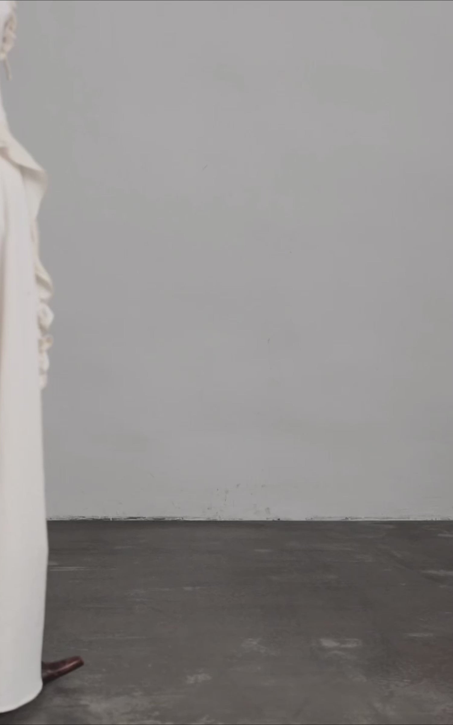 Load video: DOINDULGE Sculptural Ruffle Panel High-Waist Long Skirt