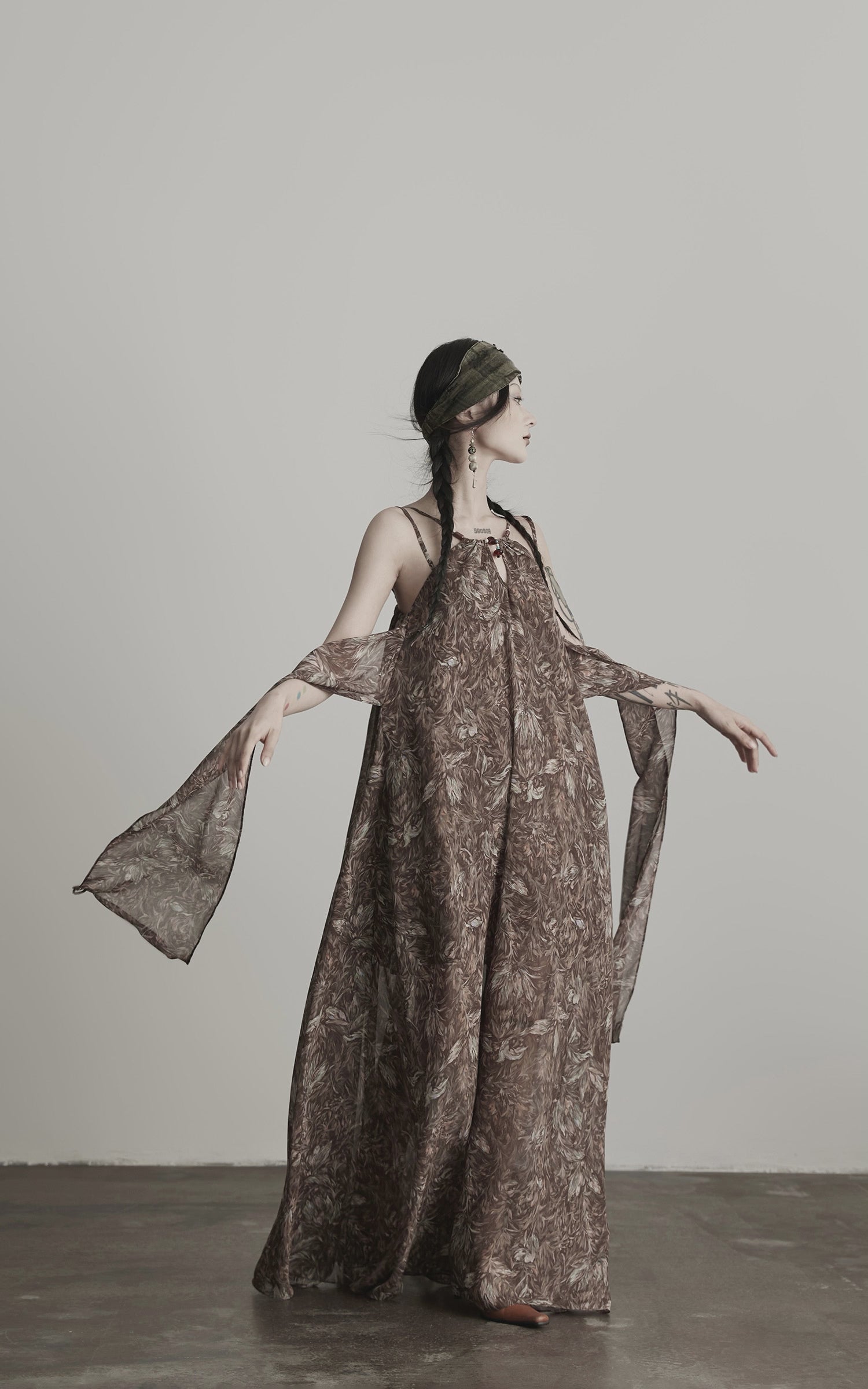 Load video: INDULGE Feather-Printed Halter Dress with Beaded Straps and Draped Silhouette