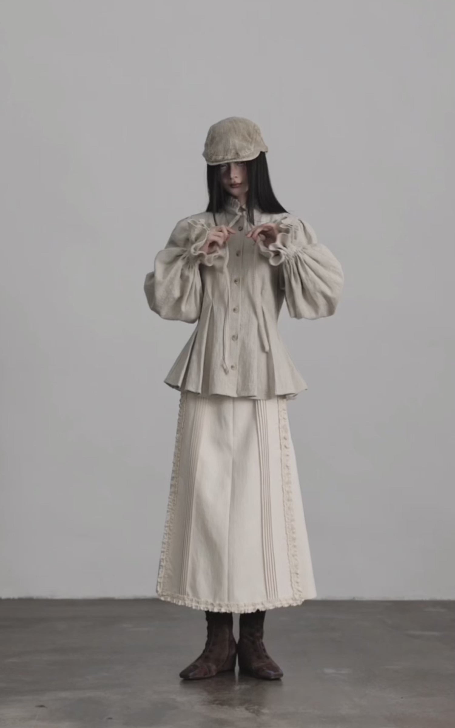 Load video: DOINDULGE Sculpted Pleated Waist Ruffle Collar Linen Shirt