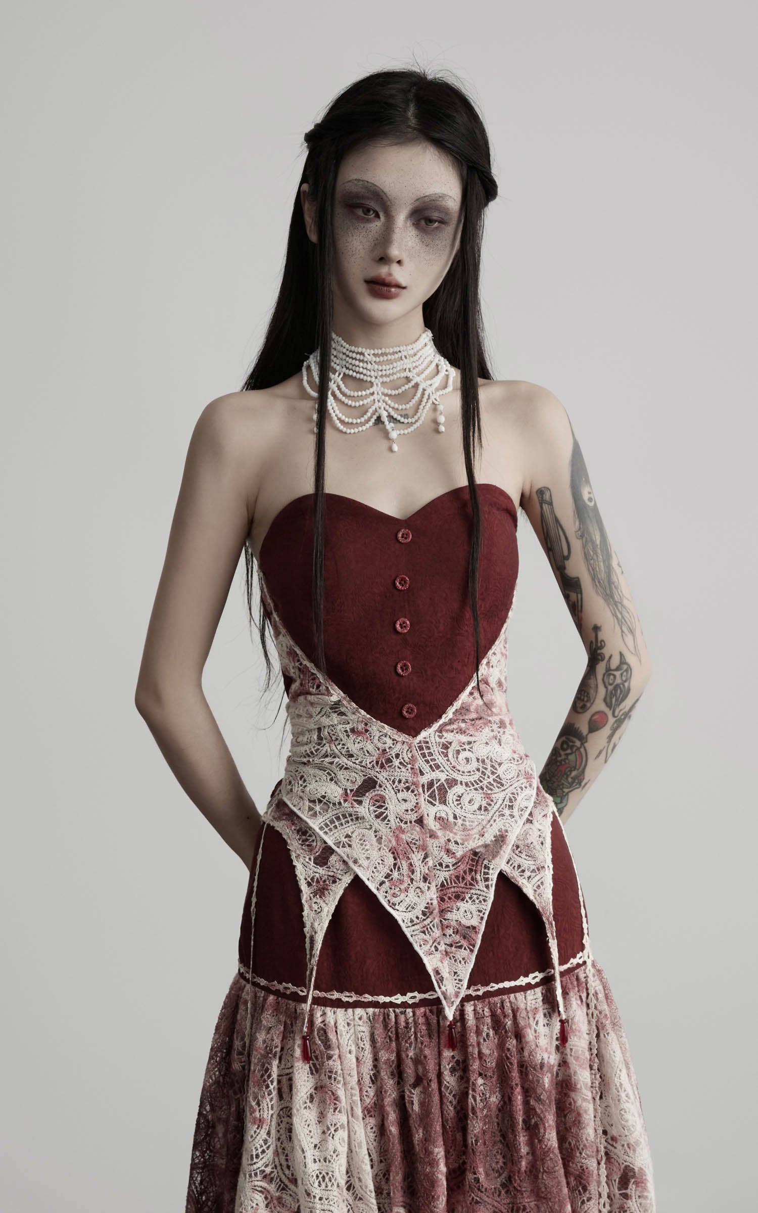 close-up of red strapless top with fitted shape and lace structure