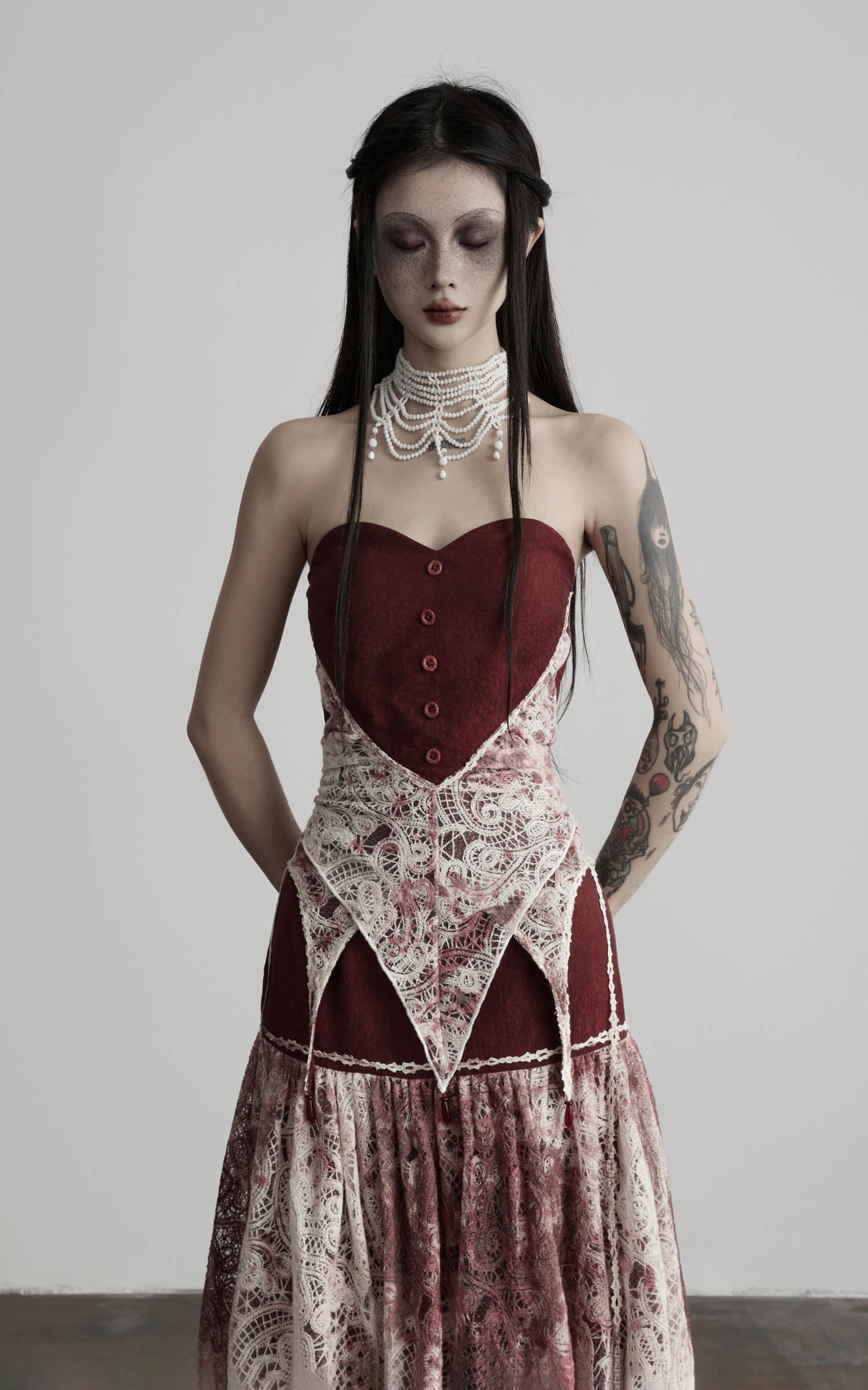 front view of red strapless top with lace overlay and fitted bodice