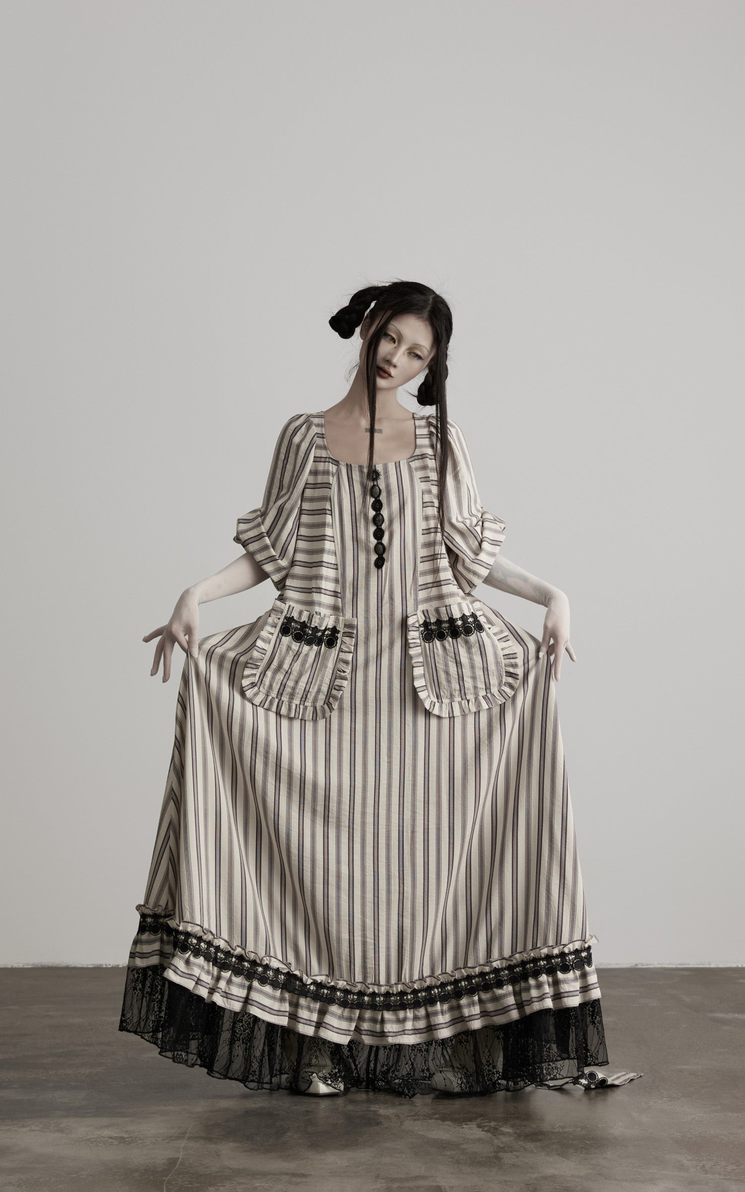 front view of beige striped maxi dress with gathered skirt