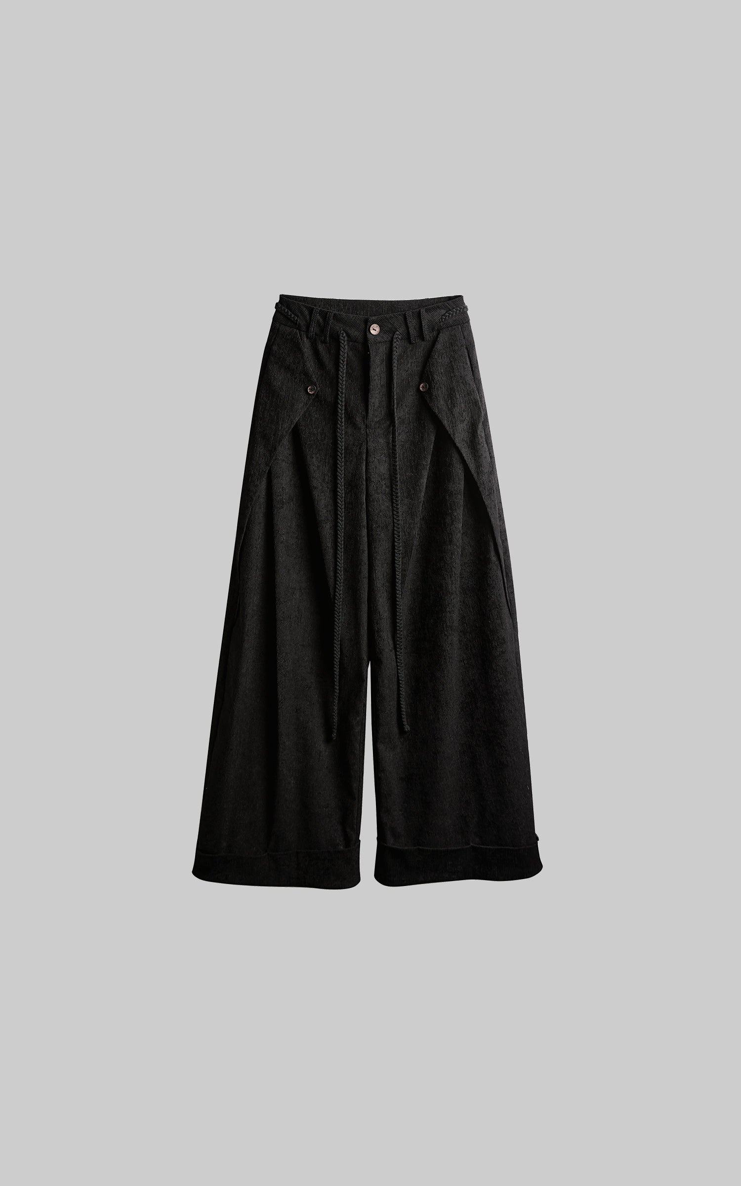 front view of black textured wide leg pants laid flat with rope detail