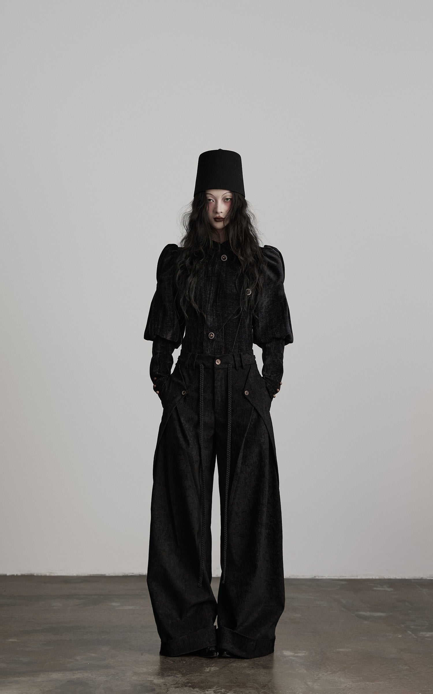 front view of black textured wide leg pants with relaxed volume fit