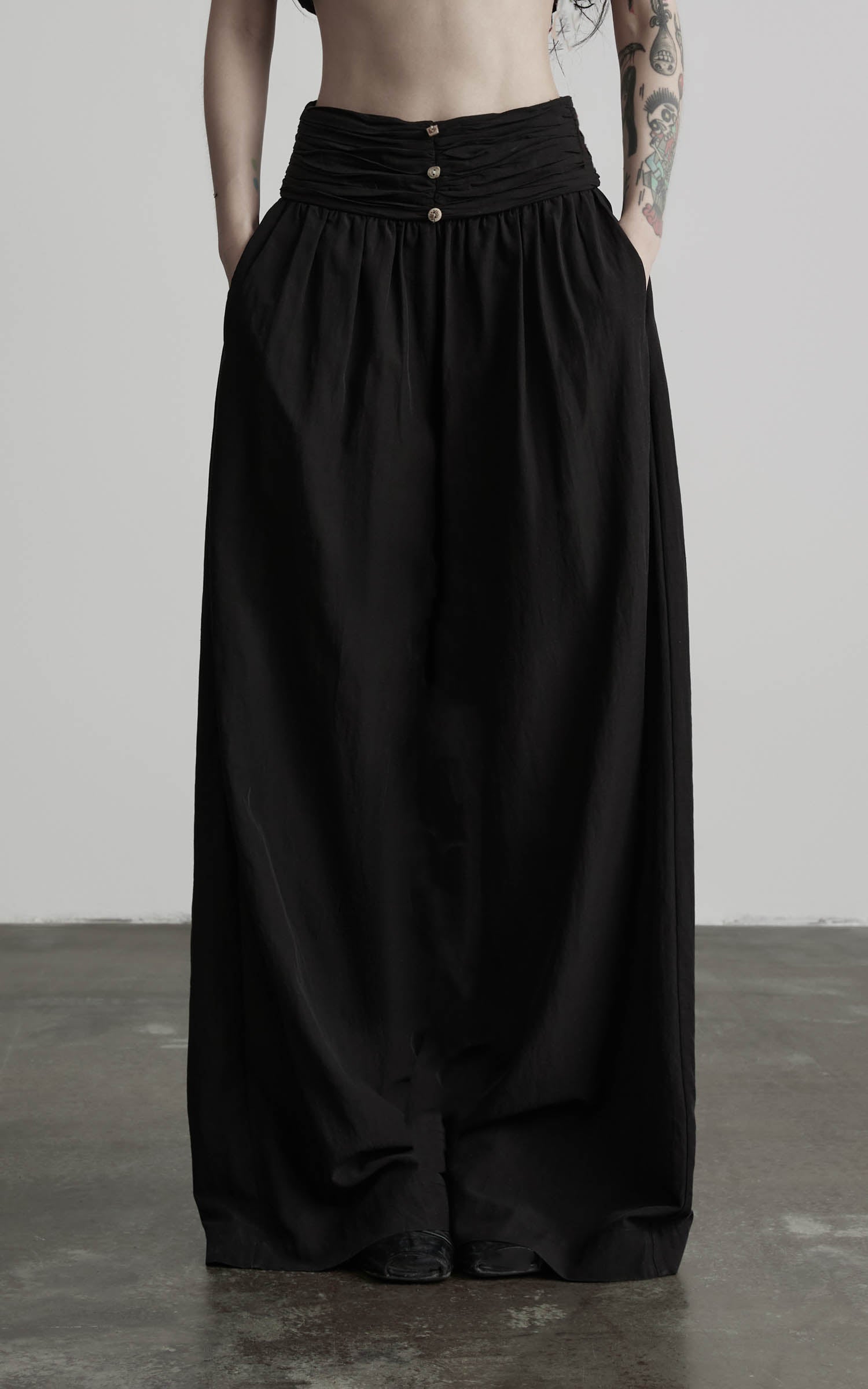 Black wide leg gathered waist pants front detail view
