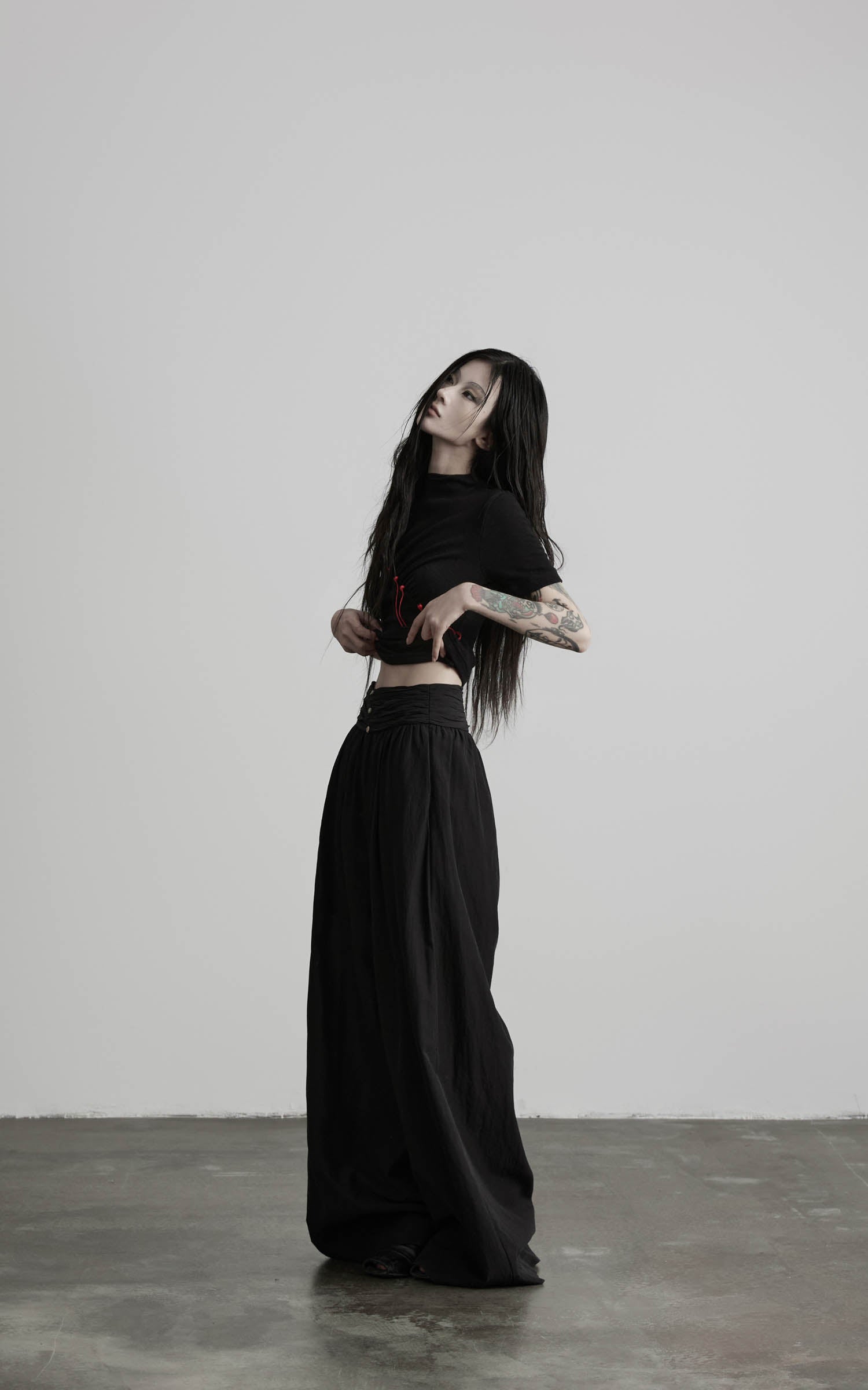 Black wide leg gathered waist pants side angled full vie