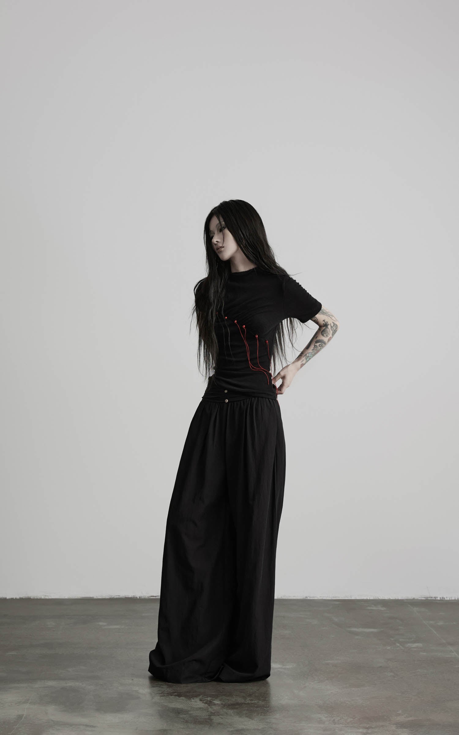 Black wide leg gathered waist pants side full view