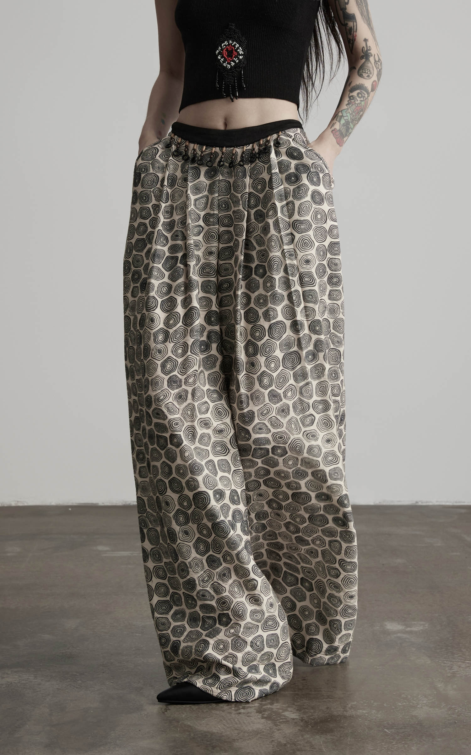 close-up of patterned wide leg pants showing movement and soft folds