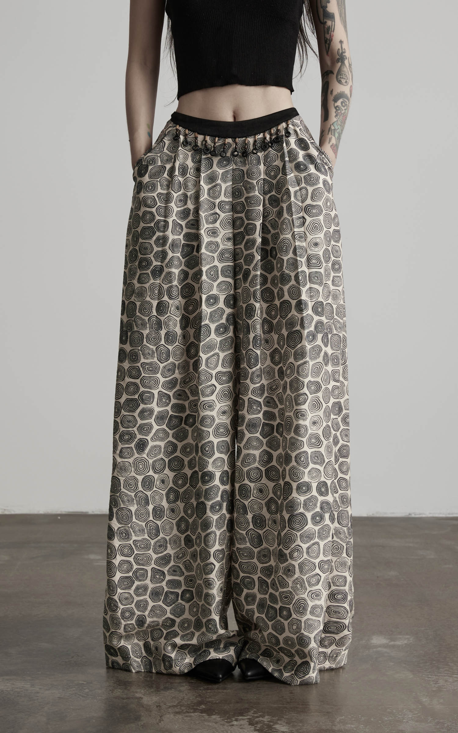 front view of patterned wide leg pants with gathered waist and soft drape